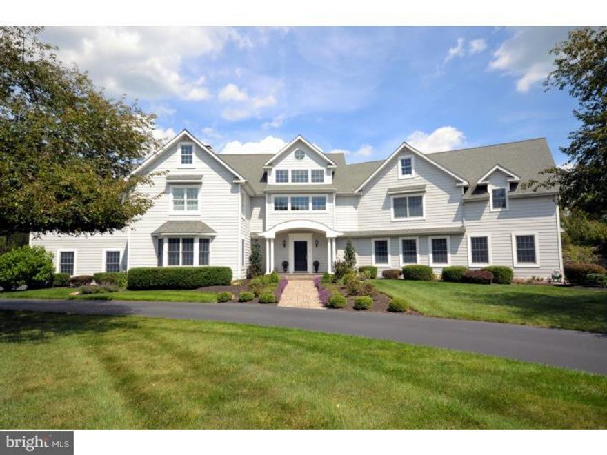 Perfectly sited on 5.38 lush acres in prestigious Timber Ridge, sits this spectacular and spacious property. Comprising over 6,500 square feet of finished space, the house was mostly renovated in 2003, has recent upgrades and is in immaculate move in condition. Featuring an open floor plan, soaring ceilings, four + bedrooms plus a first floor suite, finished walk out basement, brand new patio and more. Two gorgeous stone fireplaces, brand new luxurious Master Bath. Incredible lot is largest in the development and offers beautiful views and complete privacy. Exterior is reminiscent of a grand New England style shingle. Enter to open Foyer, Front Staircase, Grand Two-Story Dining Room & Wet-Bar. Kitchen boasts Custom Cabinets, Granite Tops & Stone Fireplace w/ Slate Hearth. Music/Piano Room, Family Room w/ Built-In Bookcases, Exposed Beam Ceiling & Large Stone Fireplace w/ Slate Hearth running length of Room. Living Room, Office/Library & Powder Room compliment the main floor. There is a Private 2 Room In-Law Suite w/ Laundry & 2 Full Baths on the first floor as well. 2nd floor offers huge Master Suite w/ Private Deck, His & Her Walk-In Closet w/ Dressing Area & Master Bath w/ Tumbled Marble. Rear Staircase leads to bridge overlooking 1st Floor. Balance of 2nd Floor offers Laundry Rm w/ Built-Ins, Walk-In Seasonal Closet, 2 Bedrooms w/ Private Baths, Playroom & separate Arts/Crafts Room. Most flooring throughout are beautiful hardwoods. Finished Basement w/ Wine Room, Playroom, & 2 large Storage Rooms. 3 Car Side Entry Garage, 5 zone heat/AC, security system, reverse osmosis water system and much more. Exterior is equally impressive w/ professionally manicured grounds in a park like setting. One of Upper Makefield's finest locations, combined with low taxes, make this property a fantastic value and opportunity.