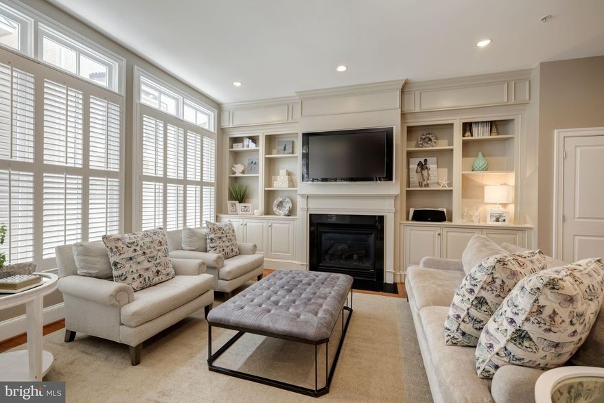 Beautiful and rarely available Morrison model townhome located in the hidden community of Potomac Greens.  Imagine yourself living in this spacious home with open floor plans and terraces off each floor.  This property features an entry-level bedroom and ensuite bath along with a handsome library with custom built-ins, and a gas fireplace.  Off the main level, you will find an overscale gourmet kitchen perfect for those who love to cook.  A wonderful family room with built-in bookcases and a second fireplace.  You will find oversized windows in the dining and living room.  Hardwood floors and plantation shutters throughout the property.  Gorgeous master bedroom suite with two custom walk-in closets, sitting area, ensuite bath with soaking tub, and dual vanities.  The upper level of the property features an additional bedroom and ensuite bath, yet this space has endless possibilities.  Enjoy the private rooftop terrace the perfect spot to end the day.  This is a must-see property with fantastic community amenities, minutes from the heart of Old Town, adjacent to George Washington Parkway & Mount Vernon bike trail, two traffic lights to DC & Reagan National Airport, near the future home of Amazon HQ2 & Virginia Tech Innovation Campus and the new Potomac Yard Metro.