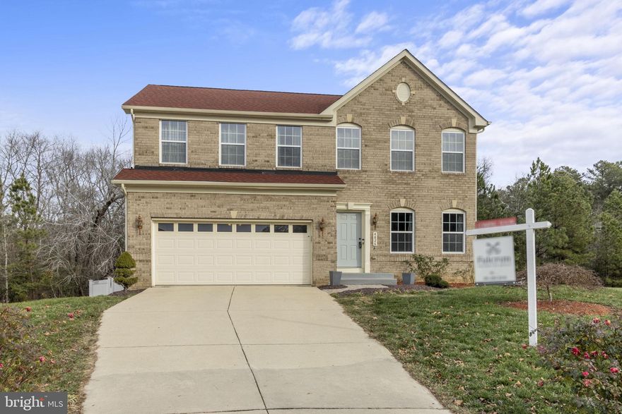 Welcome to the perfect blend of elegance and comfort in this captivating residence located in a quiet community in Waldorf!  Boasting a wealth of features and recent updates, this home is sure to fulfill your every need.  The allure begins as you step inside to discover the thoughtfully designed layout spanning three levels.  The main level seamlessly blends together a traditional floor plan with a formal living room and open floor with a great room.  The open kitchen, dining and family room is perfect for entertaining, family gatherings or quiet evenings.  Just imagine hosting, cooking while your family and friends gather round.  Kitchen boasts a new microwave, all new backsplash and beautifully refaced cabinets.  Main floor is complete with a convenient half bathroom.  Head upstairs to discover four spacious bedrooms, each providing its own unique charm.  The primary bedroom boasts a gorgeous full bath and a generously sized walk-in closet, offering both style and functionality.  The hallway full bath rounds out the upper level.  Descend to the finished walkout basement and you will find a versatile space offering endless possibilities. Whether you envision it as a playroom, additional family/rec room, craft space, or even a home office, this area adds valuable square footage to accommodate your lifestyle.  The convenience of a full bathroom in the basement ensures comfort for all.  Step outside to discover the jewel of this property—a serene koi pond and luscious landscaped backyard.  The water feature adds tranquility to your outdoor space along with the new tiled patio. Fall in love with the beautifully landscaped front and back yard with roses, Japanese maple and palms.  The spacious yard, combined with the quiet community setting, provides an ideal backdrop for outdoor activities and relaxation. Last but not least, the home boasts a 2-car garage and a spacious 4-car driveway. Peace of mind with the several home updates including a new roof installed in 2023 and a sump pump installed in 2019 - with a battery backup. Rear fence was installed in 2023 as well.  Main and lower level flooring is by Empire Flooring with transferable warranty.  Inquire for more details on 2.625% assumable VA loan. Embrace the opportunity to make this residence your own, where the perfect combination of indoor and outdoor living creates a harmonious living atmosphere. Four lakes inside the neighborhood with walking trails make for a great way to get outside. Perfectly located with easy access to 301 and surrounding amenities including St Charles Towne Center and Waldorf Marketplace. This home has it all - schedule your private showing today!  Home qualifies for the MCCT loan program. Buyer may be able to purchase with 0% down payment and a $5,000 lender grant.