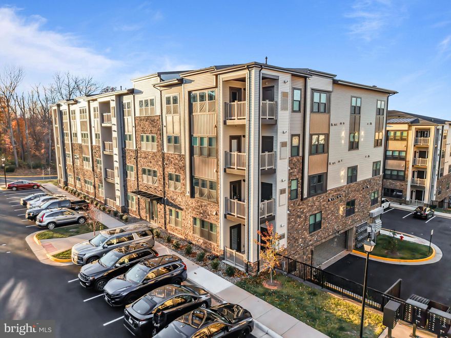 Beautiful Almost-New 2 Bedroom, 2 Bath Condo!
Welcome to this stylish one-level condo offering modern comfort and convenience. Ideally located near shopping, dining, and major commuter routes, this home features an open floor plan with upgraded luxury vinyl plank flooring throughout. The gourmet kitchen boasts a large center island, quartz countertops, stainless steel appliances, and overlooks the inviting family room with access to a private balcony — perfect for relaxing or entertaining.

The spacious primary suite includes a generous walk-in closet and a luxurious en-suite bath complete with dual vanities and a seamless glass shower. A second bedroom and full bath provide flexibility for guests, a home office, or additional living space. Enjoy low-maintenance living in a prime location — move-in ready and waiting for you!