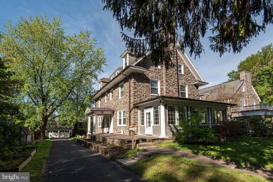 Lovingly renovated 3 story center hall stone colonial in historic Pelham in West Mount Airy.  With extra care and attention to detail, the owners of this wonderful home have replaced every inch of plumbing, every inch of electrical wiring.  They have replaced all windows.  You will find new gas-fired high efficiency heat and central air conditioning and new hot water heater--all done within the last 5 years.  Most all interior doors have been replaced.  They built a brand new covered entry at the front door.  There's a new electronic ventless gas fireplace that opens to both the living room and sunroom.  The sunroom has been essentially rebuilt with insulated windows and ceiling fans. The sunny dining room retains all its original wall wainscot and plate rails.  The new eat-in kitchen boasts granite counters and ceramic tile backsplash, multiple cabinetry, stainless steel appliances including a top-of-the-line electric range with 2 ovens/broilers (gas line below the floor in case a new owner wants gas cooking). Eating area, powder room and laundry are at the end of the kitchen with exit to rear yard.  Upstairs are 5 bedrooms and 3 baths including a master bedroom suite with a master bath to die for!  You can't miss the gleaming oak hardwood and southern pine floors.  Closets are terrific.  The unfinished basement is spotless for utilities, storage and work area as well as a separately temperature controlled wine storage room.  Please review the seller disclosure statement for a full listing of the substantial work and thoughtful upgrades that enhance this home.  Detached 2-car garage.  6828 Quincy Street is located on a favorite block of Pelham just a few steps from the Carpenter Lane Station on SEPTA's Chestnut Hill West commuter line.  It is a short walk to the shops on Germantown Avenue.