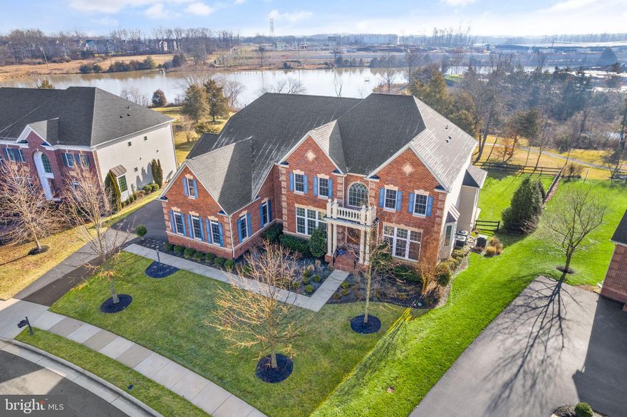 Meticulously maintained, one of a kind house located in the Meadows 2 subdivision overlooking Quail Ridge Lake, This NV Homes custom Mount Vernon model features unique architecural touches welcoming you from the curbside. Pretty portico with roman pillars and exterior trim. The foyer takes to the beautiful open floor plan with high ceilings and over 6,000 square feet of well designed living space. It boasts 4 spacious bedrooms, each with walk-in closet and full private bath, plus additional ½ bath off on the main floor; 2 fireplaces, library/office with built-in shelves, extended 4-car garage and a huge unfinished basement that awaits your creativity and your own touch. A walkout off the main level provides a tranquil setting with beautiful professional landscaping perfect for entertaining. Resort-style living with extensive outddoor space, swiming pool, a hot tub, covered veranda and wet-bar and grilling station.

Laundry/Mud Room with custom lighting and vaulted ceilings. Spacious walk-in pantry. Numerous upgrades and improvements, multi-unit HVAC serving 2-zones. 4-cars garage and extended driveway as additional parking space on top of stree parking. This house is drenched in natuarl light from angles, yet offers a private oasis setting and and much more. 

Located within driving distance to 
Brambleton Town Center: puts dining, shopping, entertainment, and amazing Brambleton Library all within walking distance. 
Brambleton Corner Plaza features retail, dining, and services, including Chesterbrook Academy Preschool.
Bram Quarter will provide even more options, and is exceptionally convenient to the adjacent Birchwood at Brambleton community.
One Loudoun. A unique place of sophisticated culture, convenient location and connectivity both in technology and the natural aspects of a harmonious, walkable community. A new urban destination that has become Loudoun County’s new downtown.  All encompassing place for living, working, shopping, dining and recreating. Everything you’ve been waiting for.
10-miles to Middleburg; Horse Counrty. Western Loudoun thrives with working farms, dairies and equestrian centers, many of which are open to the visitors. Bring the kids to pick apples, grapes and strawberries, or to pet a piglet and snuggle a sheep. Semi-annual farm tours bring Halloween fun (spooky corn mazes and pumpkin picking) while the Spring version showcases the latest blooms and newest cuddly arrivals to the farm. Loudoun is home to over 15,000 horses and has a rich equine tradition. Whether spending a day horseback riding near Middleburg, or taking in a Saturday afternoon race, it is well worth the trip. To understand the history and changing dynamics of rural Loudoun, head to the Loudoun Heritage Farm Museum with its replica general store, working garden and trove of artifacts.

Dulles International Airport is 12miles away, Moorefield Station is 7 miles away, Ashburn Metrorail Station witin 8 miles. 

Come see the pride of ownership and move-in for a stunning summer 2024. Happy living!

The Meadows lies within the Airport Impact Overlay District (within the LDN 60-65). Due to its proximity to Dulles International Airport, this site is subject to aircraft overflights and aircraft noise.