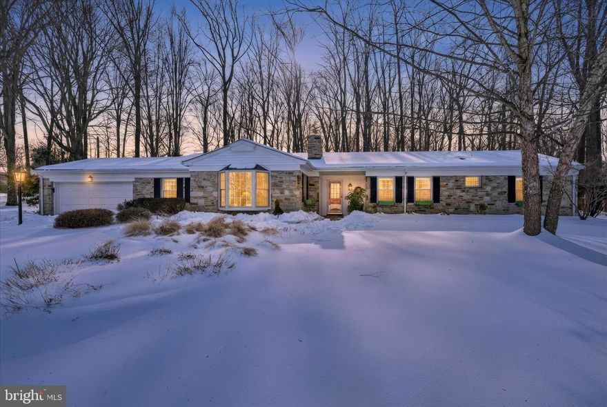 Tucked at the end of a quiet cul-de-sac in Towson’s desirable Hampton neighborhood, this beautiful stone residence offers 3 bedrooms, 3 full baths, and 2,464 square feet of thoughtfully maintained living space set within a park-like setting.

Natural light fills the main level, where generous proportions create an easy flow between living and dining areas. A lovely three-season sunroom extends the living space and overlooks the wooded backdrop, complete with a walking path and fire pit.

The kitchen offers abundant cabinetry and functionality, while the layout provides flexibility for modern living. A first-floor laundry room adds everyday convenience. The primary suite includes a full bath and walk-in closet. The additional bedrooms are well-sized and adaptable.

The finished lower level offers exceptional versatility, including the potential for an in-law suite with outside access and a second laundry area.
Numerous updates include a remodeled basement, kitchen and bath and a new HVAC system 18 months ago. The attached two-car garage provides convenience and additional storage space. Hunter Douglas shades throughout reflect quality and pride of ownership.
Residents enjoy access to a community pool and the convenience of proximity to Towson Town Center, Goucher College, Towson University, and major commuter routes.
This well-maintained home in excellent condition has the benefits of privacy and location and presents a compelling opportunity within one of Baltimore County’s most sought-after communities.