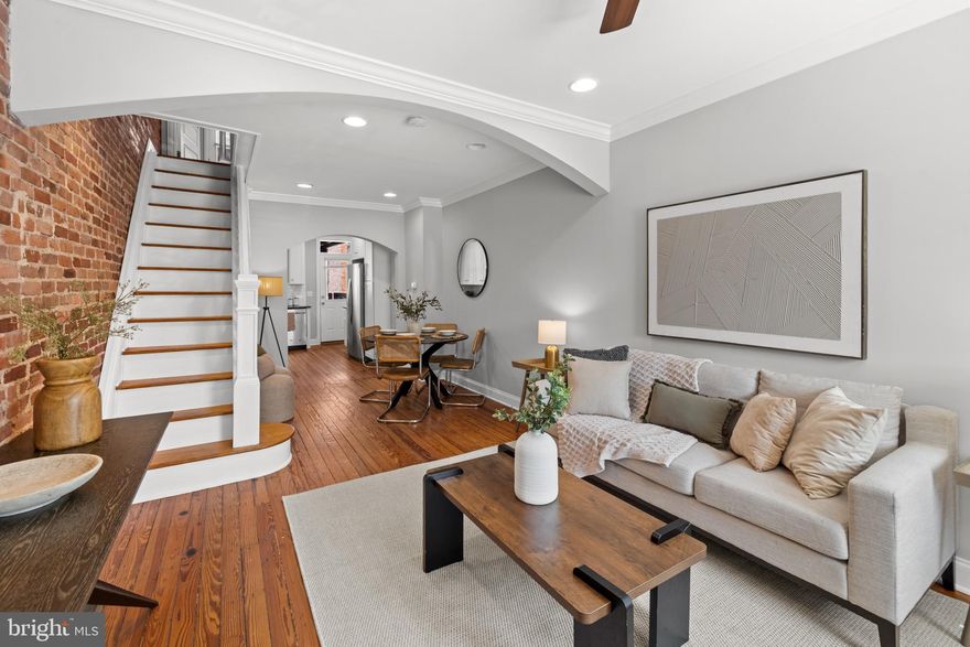 4 BEDS, 3 BATHS, PARKING, ROOFTOP DECK, CHAP, BRAND NEW ROOF! Located in the heart of Canton just one block from Patterson Park and steps from great restaurants, this 4-bedroom, 3-bath home blends modern updates with classic Baltimore charm, such as exposed brick walls, stained glass transom, original hardwood floors, and curved archways. Freshly painted inside and out, it features brand-new carpet, a refinished rooftop deck, and a brand new roof —ensuring peace of mind and move-in readiness  (all work done in 2025). Enjoy outdoor living on the spacious rooftop with skyline views, plus the convenience of a private parking pad. With 2 years of CHAP tax savings remaining, this rare gem offers unbeatable value.