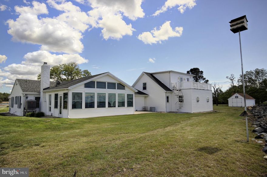 Are you in search of that serene waterfront retreat you've been dreaming of?  Feast your eyes on this exquisite contemporary home overlooking the breathtaking Big Annemessex River in Marion Station, MD!  This stunning home boasts a magnificent array of features, including tile flooring, stainless steel appliances, a tankless water heater, gas fireplace, formal dining room, attached 2-car garage, attached workshop, and 2 enclosed sunrooms to soak in those idyllic river views.  Take the staircase to the second level, and you'll discover a heavenly primary suite with a charming balcony overlooking the river. It's truly a slice of paradise.  But that's not all - this property comes with a private dock complete with a boat lift. Everything you need to fully immerse yourself in your waterfront lifestyle.  This house needs to be seen to be truly appreciated. Don't wait any longer to make your dream a reality. Call today for your exclusive showing!