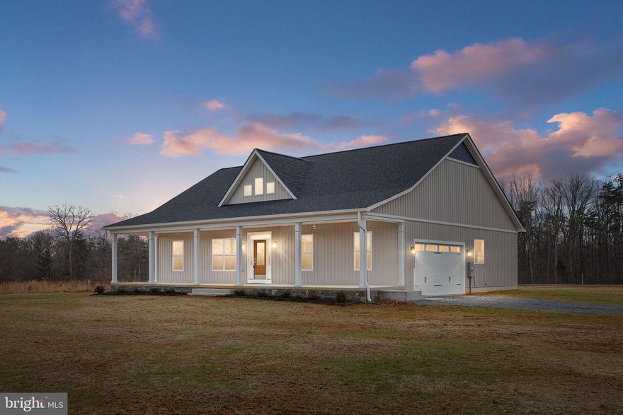 Brand New! The Country Comfort is a one of a kind home. Upgrades galore, this must be seen in person. Grand front porch will take your breath away! Relax and while away the afternoon on your expansive, wide, gorgeous country front porch. The view goes on for miles! Elegant upgraded interior has that WOW factor! Cushioned, water resistant, luxury vinyl plank floors. A full wall of custom built-in
book shelves with granite counters surrounding focal point fireplace. Kitchen features a center island, under cabinet lighting, granite counters, and top quality cabinetry - notice the soft close drawers and doors and the dovetail joints in the drawers. Not just builder grade appliances, the Country Comfort offers upgraded stainless steel GE Profile appliances. Primary Bedroom offers walk-in closet, recessed lighting, ceiling fan, and lovely views. Primary Bath includes luxurious ceramic tile shower with full glass surround/door, plus a separate, deep soaking tub. The concrete rear covered porch provides extra outdoor space so you can enjoy the nature that surrounds you. The second full bath is also fully tiled construction - no plastic inserts here! Spacious second and third bedrooms  with upgraded lighting, and upgraded padding and carpet for that cozy feeling. You will love the side load oversized two car garage that comes complete with garage door opener already installed, and is finished with drywall, paint, and recessed lighting! There is so much to love about this home, schedule your showing today. Agent related to Owner.