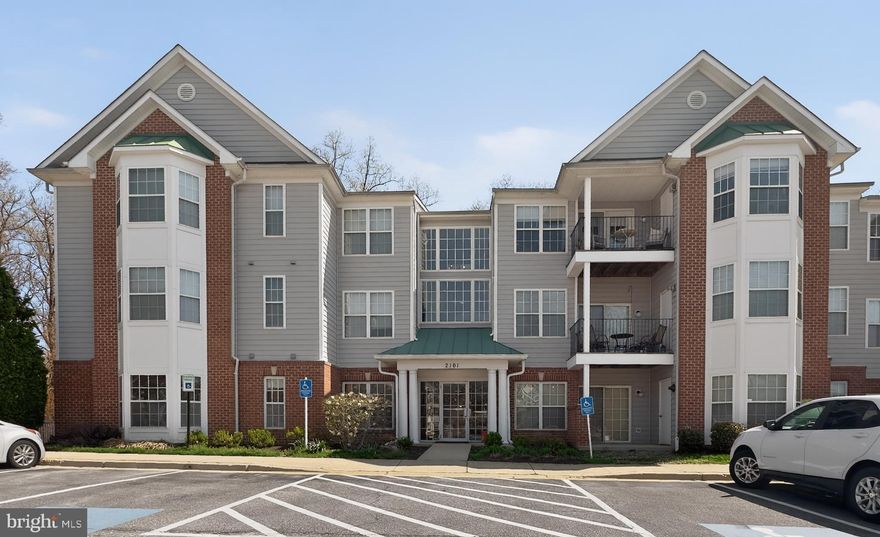 Step into this beautifully maintained top-floor 3-bedroom, 2-bath condo in the desirable Scott’s Crossing Condominiums, offering over 1,320 square feet and a prime location just minutes from the vibrant charm of downtown Annapolis. As you enter, you're welcomed by fresh paint throughout (2026), a foyer with a convenient coat closet, and elegant column accents that open into a bright and airy main living space. The kitchen features warm wood cabinetry, granite countertops, a tiled backsplash, and stainless steel appliances, along with a cozy breakfast nook framed by a bay window overlooking peaceful wooded views. Entertain with ease or unwind at the end of the day in the well-appointed living and dining areas, complete with hardwood floors, 9+ ft ceilings, a cozy gas fireplace, and access to a private patio that offers a serene setting to relax and take in the views. The primary suite is a true retreat, showcasing a vaulted ceiling with a lighted fan and a charming bay window, perfect for a reading nook or sitting area with a tranquil backdrop. Two spacious closets and an ensuite bath with a dual sink vanity and tub/shower combo complete the space. Two secondary bedrooms, each with ample closet space, are thoughtfully positioned for added privacy and versatility, whether used as guest rooms or an in-home office, and share a full bath with a large walk-in shower. A dedicated laundry room with additional storage and a full-sized washer and dryer adds everyday convenience. Recent updates include a newer HVAC (2021), water heater (2022), and plush new carpet (2026). Parking is a breeze in the off-street parking lot. Beyond the community, enjoy the nearby Bestgate Park, Trader Joe’s and Annapolis Mall, plus easy access to major highways for a quick commute to Baltimore, DC, and more. Don’t miss this rare find!