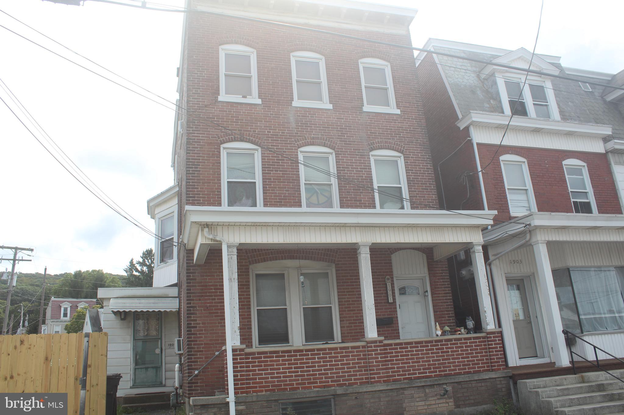 Spacious 2 unit apartment building. First floor unit is 1 bedroom with a full kitchen including refrigerator, range, dishwasher, microwave, pantry & an island. Laminent flooring throughout. This unit would make a great in-law suite. Large 4 bedroom unit on the 2nd & 3rd floors. Off street parking for 3 cars. Detached garage rented separately. Add this building to your investment portfolio. Being sold AS IS.