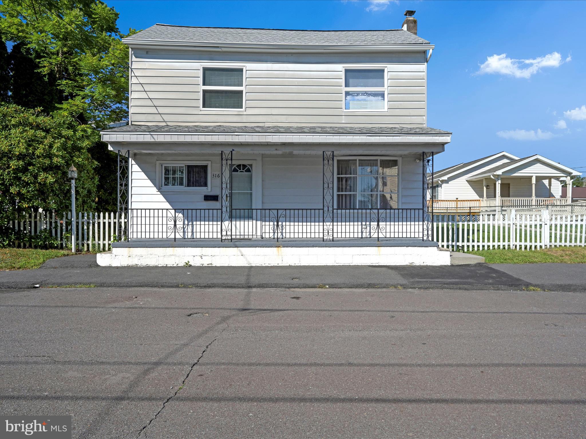 If you have been waiting for a nice single in North Schuylkill School District, you are in luck. This well cared for property in Frackville is ready for you. Here are some of the things it offers. The first floor has a living room and a den. The large kitchen/ dining area stretches across the back of the house. A laundry room/ half bath is conveniently located on this level as well. The appliances are all fairly new. The second floor consists of four separate entry bedrooms and a full hall bath.
Outside you have your choice of the front porch for chatting with the neighbors and watching the world go by or hanging out on the covered patio accessed from the kitchen.
Just look at that lot for an in-town home. Level and sunny and ready for whatever activities interest you. Like to garden? Always wanted a pool? How about just kicking a ball around? You choose. If you are looking for more activities, you are just a quick walk to the community park with a pool, basketball and tennis courts and baseball and soccer fields. Easy to set up your showing so come on over.