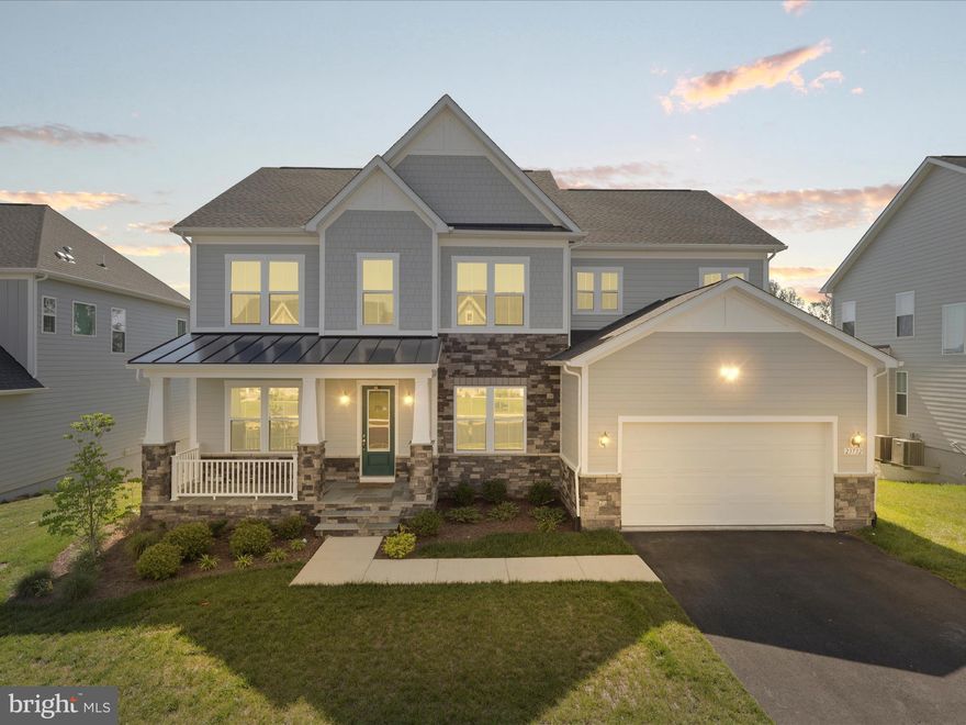 Discover the perfect blend of luxury, comfort, and style in this stunning DRB Richmond model—where thoughtful design meets high-end living in every detail. Spanning over 5,700 square feet of beautifully finished space, this meticulously maintained home offers a warm, light-filled interior and an open layout ideal for both everyday living and grand entertaining.

The heart of the home is the gourmet kitchen, beautifully appointed with quartz countertops, floor-to-ceiling cabinetry, custom lighting, and sleek designer touches. Just off the kitchen, the spacious family room features striking custom wood ceiling beams that add warmth, character, and architectural charm. Throughout the home, you’ll find luxury vinyl wide-plank flooring on all three levels, elegant crown molding, coffered ceilings, and eye-catching modern fireplaces that elevate each space.

This home offers five generously sized bedrooms, four of which feature private en-suite bathrooms for ultimate comfort and privacy. The owner’s suite is a retreat of its own, showcasing a spa-inspired Roman shower with frameless glass, dual rainfall fixtures, and floor-to-ceiling tile. A separate sitting area and spacious walk-in closet complete the suite, with a conveniently located laundry room just steps away.

Nestled in the vibrant Hartland community, residents enjoy access to top-tier amenities including a resort-style pool, fitness center, tennis and basketball courts, playgrounds, and scenic walking trails. All just minutes from shops, restaurants, Dulles Airport, and major commuting routes.

This is more than a home—it’s a lifestyle. Schedule your private tour today.