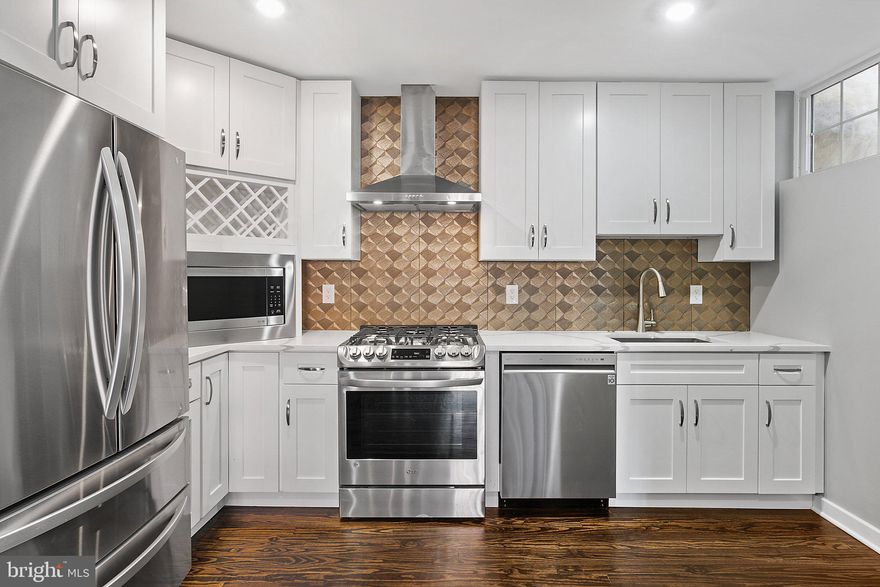 High Quality Remodel; practically new construction on one of the best blocks in Northern Liberties. Walking distance to everything! The builder spared no expense with this large 1 bedroom, 1.5 bath, 1035 sq ft unit. High end finishes include quartz countertops, champagne bronze finishes, counter depth appliances, beautifully refinished hardwood floors, high ceilings, premium tile, built in microwave with wine rack, real distressed brick, and many more. This house was designed and remodeled with the artist and energy enthusiast in mind. High efficiency central AC and heat,  upgraded insulation, vinyl double hung energy star windows, and all new plumbing and electrical throughout. Walk out your front door on this historic block and be within feet of Northern Liberties restaurants/shops, concert venues, and train station. Rare full gut rental in a desirable location! Water is included in rent; tenant pays electric and gas only. Very low utilities....