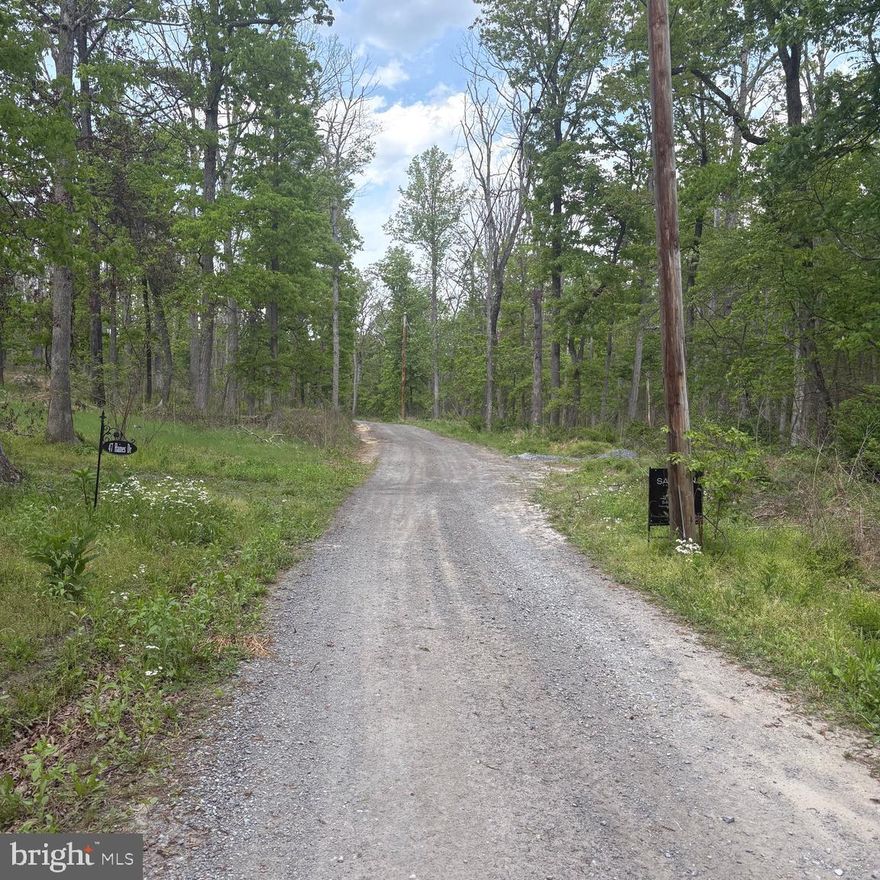 Beautiful 4.67-acre wooded lot located in the desirable Ritter's Hidden Valley mountain community! This mostly flat and usable parcel offers excellent accessibility from multiple directions, making it ideal for a weekend getaway, recreational retreat, or future cabin/home site. Enjoy peace and endless outdoor adventure with over 20 miles of community dirt roads perfect for ATVs, side-by-sides, hiking, and exploring the mountains. Community amenities include a swimming lake, stocked fishing lake, park/playground, and tennis courts. No HOA restrictions, and hunting is allowed on your own property. Electric is easily available, plus Starlink and Frontier internet options help keep you connected while enjoying mountain living. Conveniently located within reasonable driving distance to Winchester, Northern Virginia, and the Washington, DC area for shopping, dining, and commuter access. Don’t miss this opportunity to own affordable land in wild, wonderful West Virginia!