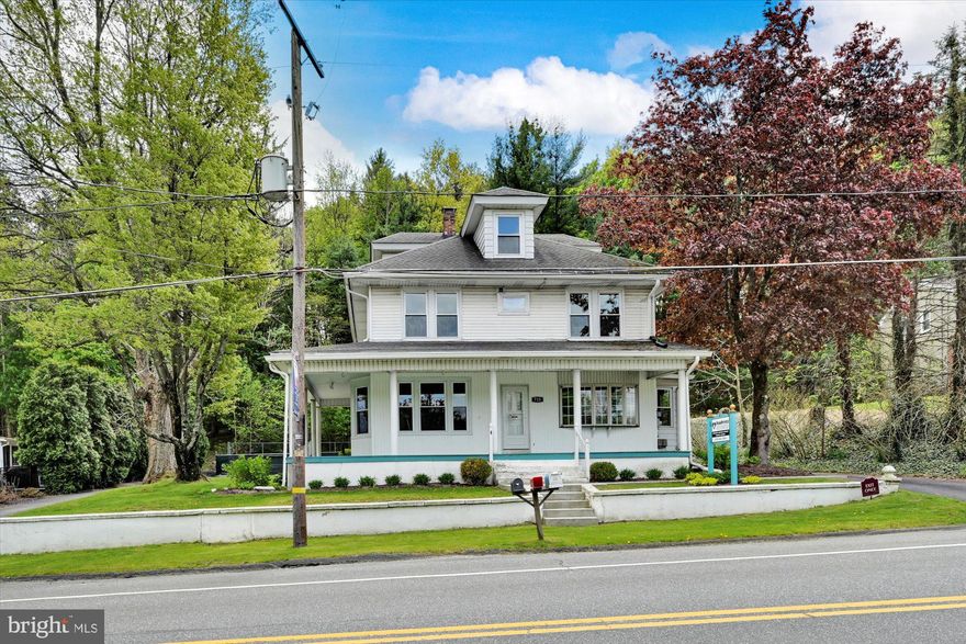 Formerly "Paw Prints Grooming", this building offers commercial space on the first floor and a residential apartment on the 2nd floor.  Great investment opportunity- operate your business on the first floor and rent the upstairs and garage. Apartment is a 3 bedroom, 1 bath unit and was renting for $1000 a month.  Oversized 2 car garage with heat and water was most recently used as a "doggy" daycare space but can easily be converted back to a garage. The garage has a separate 200amp electrical service.  Outside dog runs will remain.