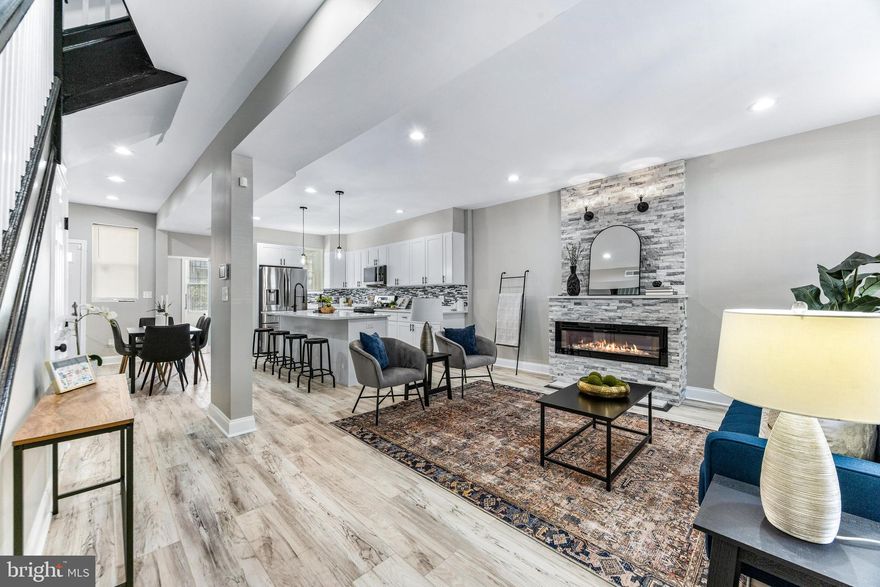 Welcome to this fully renovated 4-bedroom, 2.5-bath townhome, thoughtfully redesigned by one of Baltimore's premier developers. Every element has been selected for style & functionality. Enjoy brand-new flooring, modern custom touches, & a kitchen equipped with new appliances & sleek finishes—perfect for daily living & entertaining. Updated major systems, including a new HVAC, provide comfort and peace of mind. The spacious primary bathroom offers a unique resonance complete with ample closet space and access to the custom full bath. The finished basement offers generous space for a rec room, office, with an additional bedroom & a full bathroom. A fully fenced rear yard completes with parking easy parking potential completes this move-in-ready home. The rear deck and front porch offer a private retreat ideal for relaxing or hosting. Schedule your showing today!