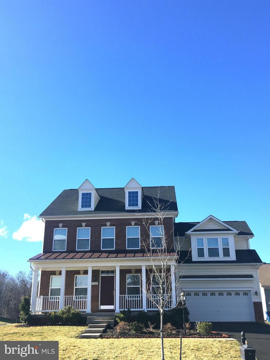 **HOME FACES EAST**      Immaculate apprx. 4300  sq ft, on 3  lvl, upgraded elevation w/brick, prem lot fronts 2 woods, lawn irrigation sys, stunning gourmet  kit w/granite & upgraded cabs! Large fam rm off kit & 5th br/office on mn lvl! UL w/ large master w/lux ba, 3 additional br's- br#2 w/full ba! Large fin LL w/ surround & projector hook ups, full ba! Large flat lot w/deck! Walk to rec center!