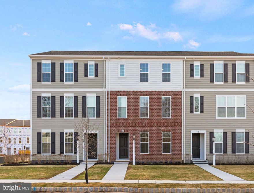Perched along the neighborhood green, this move-in ready luxury townhome combines timeless charm with modern elegance—and it’s ready for you to make it your own. Step inside to  9' ceilings and rich Luxury Vinyl Plank flooring throughout the main level. Natural light pours into the open-concept great room, dining area, and chef-inspired kitchen—perfect for both lively gatherings and quiet evenings. The front study offers a private retreat, while the kitchen wows with an oversized eat-in island, prep island, stainless steel appliances, quartz countertops, designer tile backsplash, and the very stylish rye stain cabinetry. Upstairs, unwind in the serene primary suite with a spa-like en-suite bath and walk-in closet. Two additional bedrooms and a full bath provide ample space for family or guests. The finished lower-level game room is ready for movie marathons, workouts, or weekend fun. Outside, a classic partial brick façade and thoughtfully landscaped entry create undeniable curb appeal, while expansive green space right out front invites outdoor living. Located in the sought-after Cumberland Valley School District, Grange blends small-town charm with luxury finishes. Move in before the end of the year and start living your dream. Nestled in the heart of the Cumberland Valley, Grange features preserved spaces including a wildflower meadow, green areas shaded by century-old trees, walking trails, and gathering spots perfect for connecting with friends old and new.