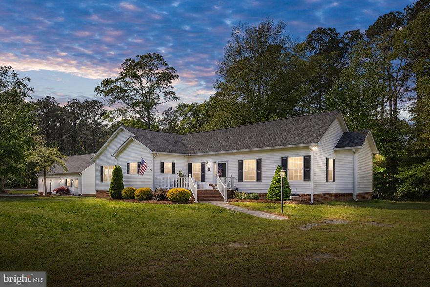 This home and adjacent detached garage are situated on two large lots (.81 acres) and are in front of a third lot (.349 acre) composing the property footprint of just over 1 acre. The extra lot could be used for building another home or could be sold if desired. That space is in front of the community boat launch! The spacious home features a beautifully updated kitchen with granite counters, stainless steel appliances and a convenient island, along with a butler’s pantry and large eating area.  Ceilings throughout are 9’ enhancing openness while crown moldings, recessed lighting, faux plantation blinds, and gleaming wood flooring add a gracious feel. The thoughtfully positioned formal dining room adjoins both the kitchen and the enormous family room highlighted by a stacked-stone gas fireplace. The Primary Bedroom Suite features a lovely soaking tub and walk-in closet. There are 2 additional large and well-appointed secondary bedrooms. Enjoy the water view, a sunset or nice meal from the deck or screened porch.  The detached 40'x30' two-car garage has built in work benches, ample storage for boat(s) and toys and has a 420 sq. foot bonus room heated and cooled by a mini-split system.  It can be used as a recreation room, gym, video game area, man cave, office or retreat!  There are two large utility sheds and a detached carport behind the garage!  Located on Lower Machodoc Creek, this property offers quick access to the Potomac River. The community has 4 sand beaches, 2 boat ramps, tennis courts, swimming pool, club house and more! All the modern amenities: Atlantic Broadband Wifi, and community water.  Welcome to Virginia's Water Wonderland - "The Northern Neck," - Virginia's best kept secret, only  two hours drive from Northern Virginia/DC and even less from Richmond.  And welcome home!