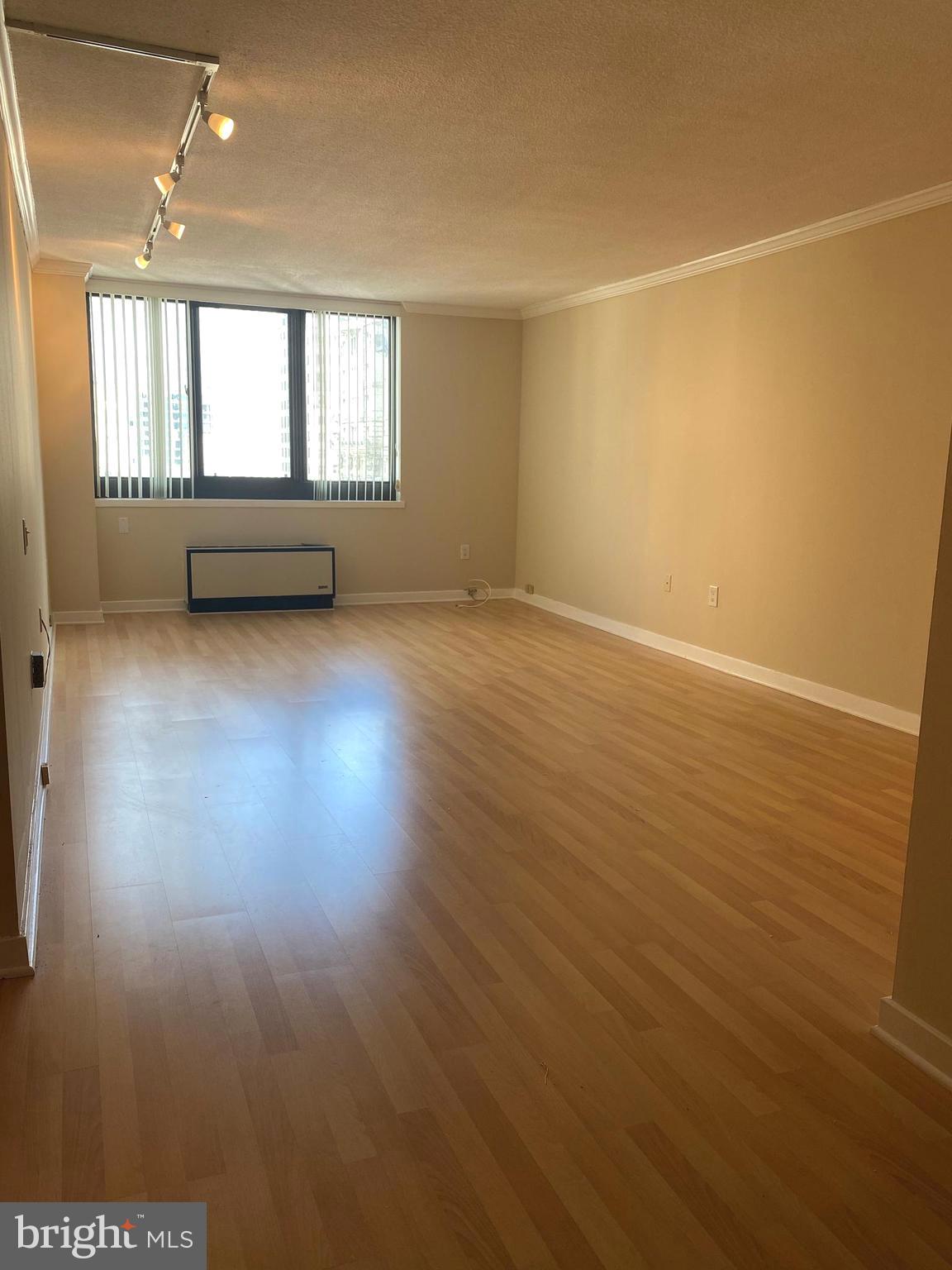 Sun-soaked 1 bedroom, 1 bathroom condominium at The Academy House on The Avenue of the Arts! The home features a spacious living room and separate but open dining room, perfect for entertaining; an updated galley style kitchen with great cabinet and counter space, as well as granite countertops; a large bedroom with plenty of storage and a modern large hall bath with a stackable washer and dryer. Additional home highlights include wood floors in the foyer, dining and living rooms; carpet in the bedrooms; and track lighting throughout. Residents of Academy House enjoy a 24-hour doorman and a brand new, state-of-the-art fitness and aquatic center. There is valet parking in the building's garage for an additional monthly fee, subject to availability. The Academy House is located in the heart of Center City and within close walking distance to Rittenhouse Square, Washington Square, and the Broad Street and Market Street office corridors. The Philadelphia International Airport and Amtrak's 30th Street Station are easily accessible.