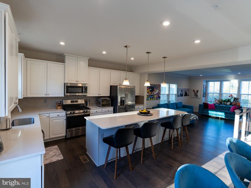 Nestled in a serene setting, this exquisite end-of-row townhouse, built in 2020, offers a harmonious blend of modern luxury and comfort. With 2,232 square feet of thoughtfully designed living space, this home is perfect for those seeking an elevated lifestyle. Step inside to discover an open floor plan that seamlessly connects the family room to the gourmet kitchen, creating an inviting atmosphere for both relaxation and entertaining. The kitchen is a chef's dream, featuring a spacious island, built-in microwave, self-cleaning gas oven, and a sleek refrigerator, all designed to enhance your culinary experience. The elegant cabinetry and high-end finishes add a touch of sophistication, making this space not just functional but also a focal point of the home. The upper level boasts generous walk-in closets, providing ample storage while maintaining a clean and organized aesthetic. The fully finished walkout basement offers additional living space, perfect for a home theater, gym, or guest suite, ensuring that every corner of this home is utilized to its fullest potential. Embrace the tranquility of nature with direct access to the Back River, where fishing and leisurely water activities await. The property's water access features allow you to indulge in a lifestyle that celebrates the outdoors, whether it's a peaceful morning by the water or an afternoon of fishing with friends. The attached garage with front entry provides convenience and security, while the driveway offers additional parking for guests. The exterior of the home is designed for low maintenance, allowing you to spend more time enjoying the luxurious amenities and less time on upkeep. This property is not just a home; it's a lifestyle. Experience the perfect blend of modern elegance and natural beauty, where every detail has been meticulously crafted to provide comfort and sophistication. Whether you're hosting gatherings or enjoying quiet evenings by the water, this townhouse is a sanctuary that invites you to create lasting memories. Don't miss the opportunity to make this exceptional property your own.