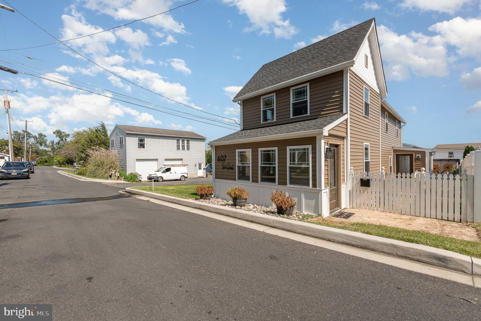 Welcome to this fully renovated and modernized 2 bedroom, 2.5 bath colonial home just blocks away from the water and downtown Havre De Grace. This home has been tastefully redone in a modern way while still retaining some of its old country/waterfront charm. Things such as exposed beams, custom tile work, water views, fully fenced side courtyard and rear yard with large storage shed and gorgeous landscaping make this home the idyllic retreat to live in or possibly even make the perfect Airbnb. The main level has a sunroom foyer which enters into the large living area, this follows into the formal dining area, powder room and laundry room which then leads into a custom high quality kitchen. The kitchen has granite countertops on one side and butcher block on the other, custom cabinetry, backsplash and stainless appliances. A door off of the kitchen leads to a tiled mudroom with exits into the side courtyard and rear yard. Taking the stairs to the second floor leads you to a carpeted floor with two large bedrooms each with their own full modern bathroom. The finishes and tilework in these bathrooms is remarkable. Enjoy water views of the Susquehanna from the rear bedroom window.
Heading down into the unfinished crawlspace area gives you plenty of room for access to the mechanical components of the house. This home has been tastefully done with no detail spared from the trim work throughout to the exterior. Come see it today and see why you should call it home!