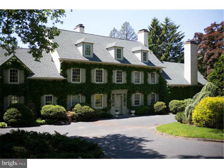 "Boxwood", a Main Line Landmark, is a gracious 5-6 bedrooms/ 5.5 baths gated Country Manor with an independent 1 bed/1 bath apartment above the 3 car Garage. It sits on over an acre of exquisite private gardens made of hundreds of perennial plants blooming or changing color constantly during the year and completely fenced in and with pool. The walled formal garden is the hidden jewel, a true piece of "outdoor art". The original house was built over 100 years ago. The different owners (especially the present one) have added on to the existing structure and tastefully updated it creating an enchanting and easy to live in space. Most of the rooms are of very noticeable size, have several windows and at least 2 side exposures: the result is wonderful cheerful spaces constantly full of light. An elegant circular driveway allows plenty of parking space for all the visitors. 1st Floor: front to back center hall with fire place; large Living room with fire place and door to the flagstone patio; spectacular Library (vaulted ceiling with exposed beam, fireplace, built-ins and large glass doors opening onto the patio and the walled garden); enchanting dining room with fireplace, bay windows and outdoor exit (perfect for a small dinner party or as a beautiful banquet room), "grand" kitchen and breakfast room with picturesque bay window; step-down Family room with doors to 2nd patio (part of the most recent 2-story addition), spacious laundry room, side foyer/mud room. 2nd Floor: Master Bedroom suite (added on in 1996); the original master bedroom of the house with fireplace, its own bath and 2 walk-in closet; another very generous size room with connecting bath and a smaller 4th bedroom (office or nursery)with hall bath. 3rd Floor: 2 bedrooms (one quite large) and a hall bath. Above the garage a 800+ sq. ft. apartment that can be accessed from the side foyer or the garage: spacious living room/ dining room combination, small kitchen, large bedroom with computer/office area, full bath. This precious home offers incredible charm and elegance and a very warm feeling.