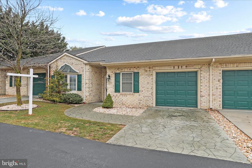 Situated in the desirable Cortland Manor, this home offers an open floorplan with beautiful hardwoods/tile in the main living spaces and 9’ ceilings throughout. The kitchen is spacious and functional, featuring plenty of cabinetry, a breakfast bar, and a seamless transition into the dining area.  The sunroom is a cozy space that opens to a covered porch with a stamped concrete patio.  Additional features include an office room off the main living space and ample storage throughout the home. The large primary suite includes a primary bathroom. Enjoy the perks of low-maintenance living with a low monthly condo fee that covers lawn care, snow removal, trash and overflow parking. Conveniently located near shopping, dining, and commuter routes.