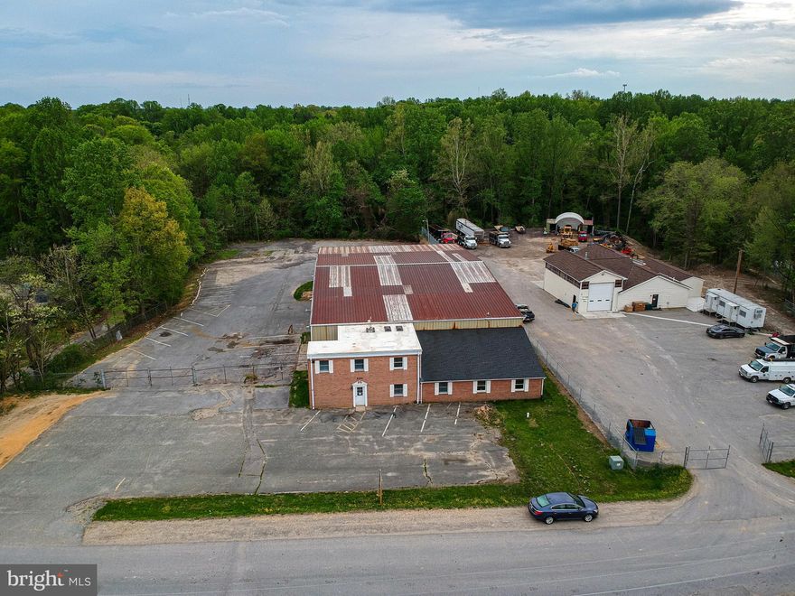 WAREHOUSE & FENCE YARD: 11,278 SF +/- Industrial Warehouse Building  w/  1,900 SF +/- of Finished Office Space Situated on Approx. 2.96 Acres in La Plata, MD. Zoned IG (General Industrial). Property Offers Three (3) Drive-In Overhead Warehouse Doors, One (1) Dock and Approx. 1 Acre Rear Fenced Yard. Private Well & Septic. Direct Access to US Route 301 via W&W  Industrial Road. Landlord Will Consider All Allowable Uses Under Current Zoning. Triple Net Lease Structure.