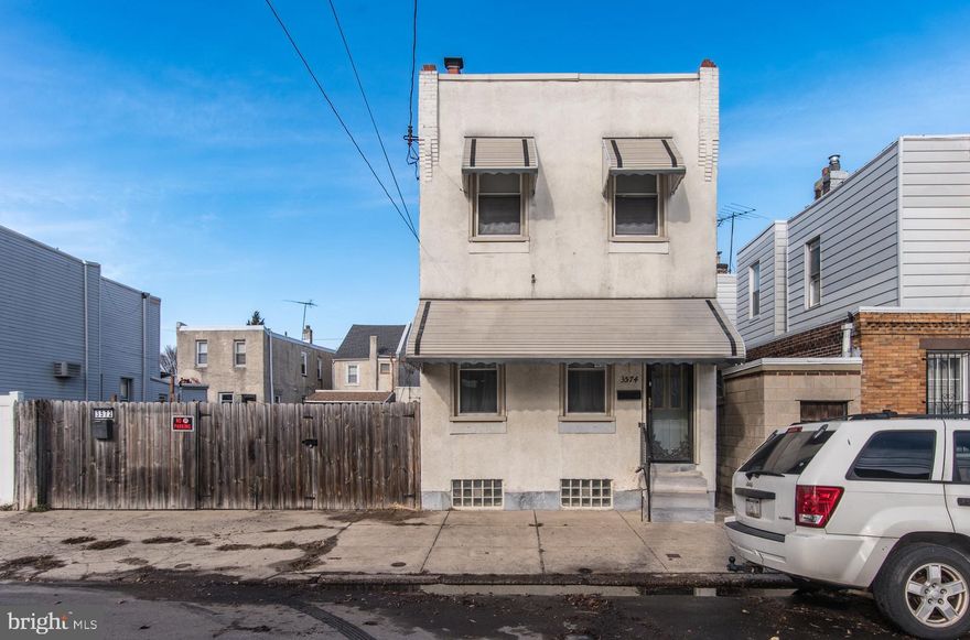 Don't miss this unique opportunity to own a large single-family home at 3574 Thompson St. plus the adjacent lot at 3572 Thompson St. (Tax ID 451251810) all in one! This spacious 3-bedroom, 1-bath home offers endless potential. Step into the open living room with high ceilings and abundant natural light. The eat-in kitchen boasts plenty of counter space, tiled floors, and a bay window overlooking your oversized backyard—complete with a large deck, a paved driveway for up to 4 cars, and space for outdoor fun or potentially a future pool. The partially finished basement provides extra living space and ample storage. Upstairs are 3 bedrooms highlighted by the generous sized primary bedroom featuring dual closets, while the bathroom includes a large tiled shower with glass doors. Conveniently located near schools, dining, shopping, and just minutes from I-95. This home is ready for you to bring your vision to life—schedule a showing today!