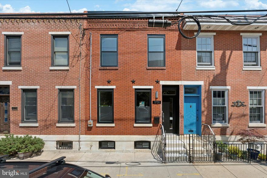 Modern NEW REHAB in East Passyunk Crossing. Enter into a bright living space featuring a brick accent wall and clean finishes. The kitchen offers gold hardware, stainless steel appliances, quartz countertops, and direct access to a spacious backyard. A half bathroom sits just off the kitchen for convenience.  Upstairs features two bedrooms and two full bathrooms. The primary suite includes a modern fireplace, black hardware, and a private en-suite, well-appointed bathroom with sleek finishes. The finished basement adds extra living space, washer and dryer, and plenty of room for storage or entertainment. Great location near shopping, restaurants, and public transit. TAX ABATEMENT APPROVED. 2 Bed | 2.5 Bath | Finished Basement | Backyard | Washer/Dryer. Schedule your showing today.