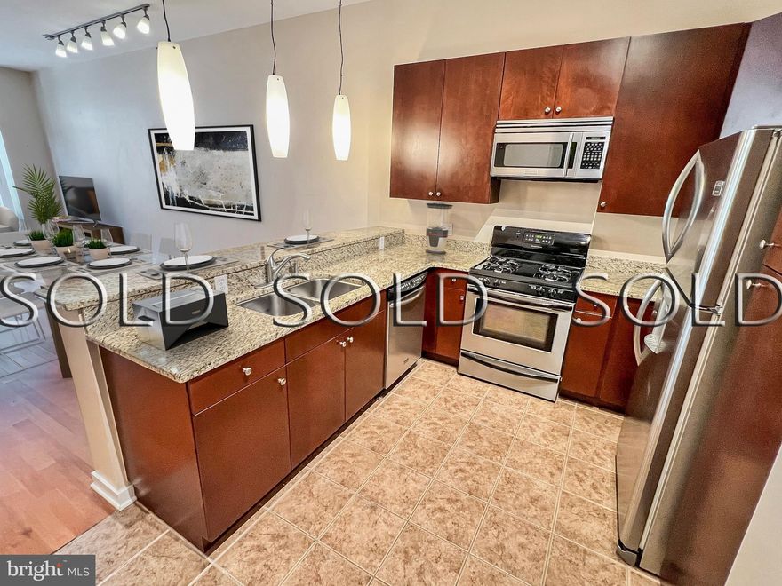 This Twelve09 North Charles condo with parking in hot Mount Vernon is a gorgeous and very secure *second* floor (not ground level), 1 BR, 1 BA unit that faces west and is graced with the most incredible sunlight, the veritable wall of windows being a wonderful feature! With nearly ten foot tall ceilings, this condo feels airy and spacious. The kitchen has the requisite granite counters, assisted-close drawers/cabinets and stainless steel eye candy (gas stove!). The laminate floors help keep dust at bay and are easy on the eyes. The gas HVAC has an ultraviolet air filter, perfect for that next COVID surge. Plenty of storage exists with the two hall closets (stacking laundry units in one) plus two bedroom closets. The gym is close by and convenient enough that there's no excuse to not work out! Walk your pet in the courtyard or relax by the outdoor fireplace with a book or your favorite beverage. Just two blocks from Penn Station, the Johns Hopkins shuttle and other college shuttles, and blocks away from the thriving arts district, MICA, the Meyerhoff Symphony Hall, the Lyric Theater, Center Stage and the Charles Theater! Excellent casual dining on the block including Chipotle, Peruvian chicken, Starbucks and Soups On one block away. Top rated cafes,  bars and restaurants such as Allora, Brewer's Art, Alma Cocina, Tapas Teatro and The Helmand Restaurant beckon with outstanding culinary experiences! Separately DEEDED PARKING for one car is included in the price. Photos are virtually staged.