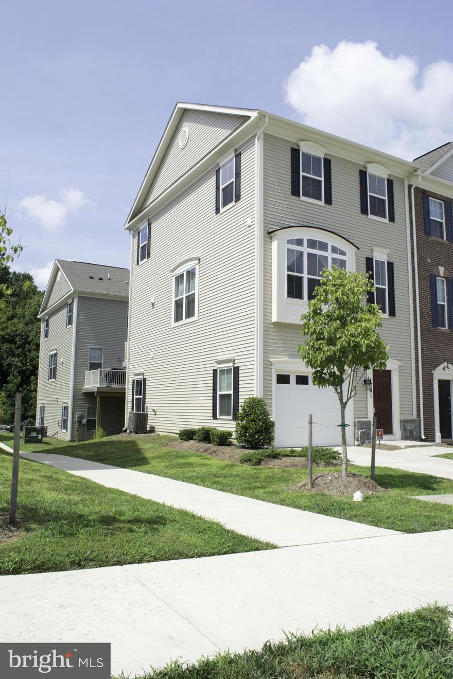 JUST REDUCED!! Sought after Luxury 3 BR, 2 full & 2 half BA END UNIT! Upgraded Gourmet Kitchen w/granite, stainless, and large island.  Open floor plan with elegant interiors--hardwoods, crown molding, and large rear deck. Spacious BRs with laundry on BR level. One of the larger TH in Potomac Highlands! Home Warranty Included. WATER included in low condo fee. Close to Quantico, I-95, Rt 1 & 234