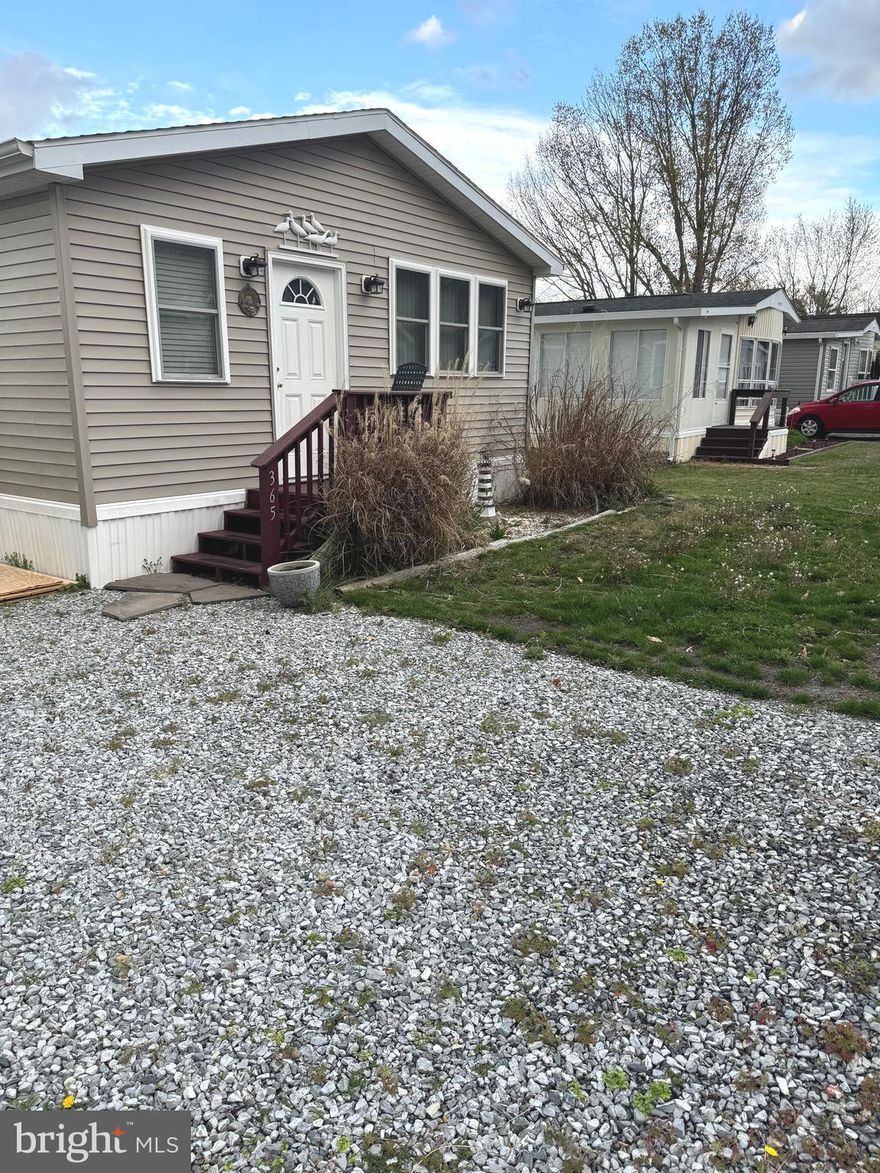 Adorable 3 bedroom 1 bath cottage located in the popular vacation neighborhood of White Horse Park. This home is clean as a pin, well maintained, move in ready, with plenty of parking, large shed, and washer/dryer. It is being sold mostly furnished and ready to enjoy this summer! Great pool, boat ramp, kayak storage, playground, and boat storage too.  
Please note there are some limited restrictions as to when you can stay in park during winter months. There is off season occupancy use per county code. Full time use April 1-September 30th. 60 days total use from October 1-March 31 with a 30 consecutive day max. Ask listing agent or park manager. Park is open 365 days. Must enter park w/REALTOR by signing in at either office or security gate. Office is open 8am to 4pm except closed on Sunday. When office is closed security guard is at gatehouse in front of office.