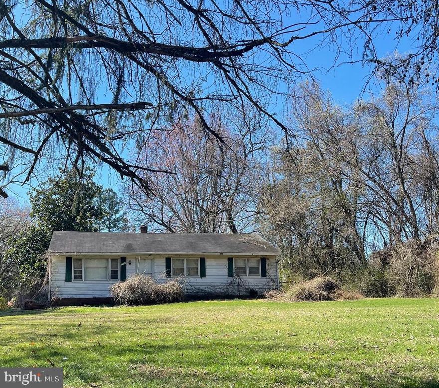 Extra large, 1 acre lot for you to imagine and build your own private house- compound- oasis!  Close to everything and yet tucked back off the road, this lot has amazing potential. No HOA- you can design and build a custom home. Close to a ton of local amenities- all of Backlick's shops, restaurants and grocery stores plus the mall. Easy access to 495, 95, the Parkway + 2.4 miles to Metro Station. 

House and lot are being sold completely AS-IS. House is not habitable. Do not enter the house or sheds. 

DO NOT ENTER THE HOUSE. CALL AGENT TO WALK THE LOT WITH AN APPOINTMENT.
Septic system on property- there is a sewer easement in the back of the lot than can be connected to a new home.