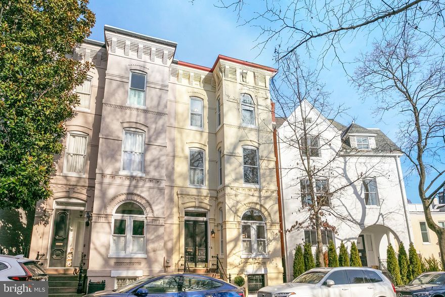 This historic gem, dating back to before 1900, presents a Federal-style brick facade exuding timeless elegance. Across its four floors and over 4100 square feet, it boasts five bedrooms and 4.5 baths, offering ample space for both casual relaxation and formal entertainment. Upon entering the house, you're greeted by a first level adorned with beautiful elegant detail work. Intricate moldings frame the ceilings, while pocket doors subtly divide the spaces, allowing for seamless flow. Original millwork adds depth and character to every corner, showcasing the craftsmanship of a bygone era. Ornate fireplaces in both the living room and dining room serve as focal points, each with its own unique charm and history, inviting cozy moments on chilly evenings. These exquisite touches further enrich the Federal-style ambiance, preserving the timeless elegance that defines the home's character. Adding to the sense of grandeur are the 10-foot + ceilings, while the lower porch off the kitchen and dining area provides a cozy retreat for al fresco dining, and the upper porch off the owner's suite offers a tranquil space for morning coffee or evening unwinding. The front grand stair and beautiful rear staircase allow access to all floors, ensuring seamless movement throughout the house. Additionally, the lower level contains a family room with a walkout to the rear garden, along with an in-law suite, providing added versatility and functionality to the home's layout. Moreover, the property boasts plenty of outdoor space, including an oversized rear garden, perfect for enjoying the outdoors in privacy and serenity. Situated in the heart of the coveted East Village of Georgetown, a block from the Tudor Place Mansion and Gardens, the location offers unparalleled convenience. Nature enthusiasts will appreciate its proximity to Montrose Park and Dumbarton Oaks.
