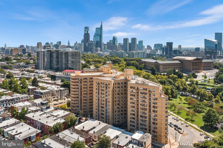 Perched just above the treetops, with beautiful skyline views and greenery galore, this meticulously renovated 3-bedroom home at 2601 Parkway Condominiums has an abundance of storage and functionality. The entry gallery with plentiful coat storage leads to the living and dining spaces. A generous and comfortable eat-in kitchen with banquette seating flanks the fully renovated kitchen with black marble with brass inlay tile, a dedicated pantry space, Bosch dishwasher, gas cooking, and 3 windows. 

The living room enjoys Southwest views of the City Skyline, art Museum, treetops, and UCity with generous open space, built-in shelving and a fireplace. Through the hallway, access to three bedrooms, the first being used as a den/sitting room, the second as a guest suite and office, plus a full bath. The primary suite has a corner window with expansive views (an amazing reading nook) plus its own ensuite bathroom, great walk-in closet, and another wardrobe wall. Each bathroom enjoys heated floors and spray bidets, while the hall bath contains a linen closet. 

The entire condo underwent an extensive, full renovation less than 3 years ago including all major systems. New ductless HVAC systems in each room, new ceiling fans in all rooms, Miele stackable washer and dryer, new water heater, updated electrical, all new appliances, and new flooring. 

One of few condos at 2601 Pennsylvania Ave to have garage parking. The parking space is the first spot inside the garage making your ins and outs extra easy! Any of the 69 parking spaces in the garage can  (optionally) support Level 2 EV Charging (240 Volt) for a one-time $875 activation fee + monthly electricity usage. 2601 Parkway Condominium Residents enjoy a 24-hr gym, onsite convenience store, concierge, and community center. Trio BYOB is also onsite, as well as a commercial corredor with drycleaner. 

Enjoy life in the amenities-rich, full service, art-deco, 2601 Parkway Condominiums, just steps from The Art Museum, The Ben Franklin Parkway, UPenn, I-76, 30th Street Station, the Schuylkill River Trails, Whole Foods, and so much more! Schedule your tour today.