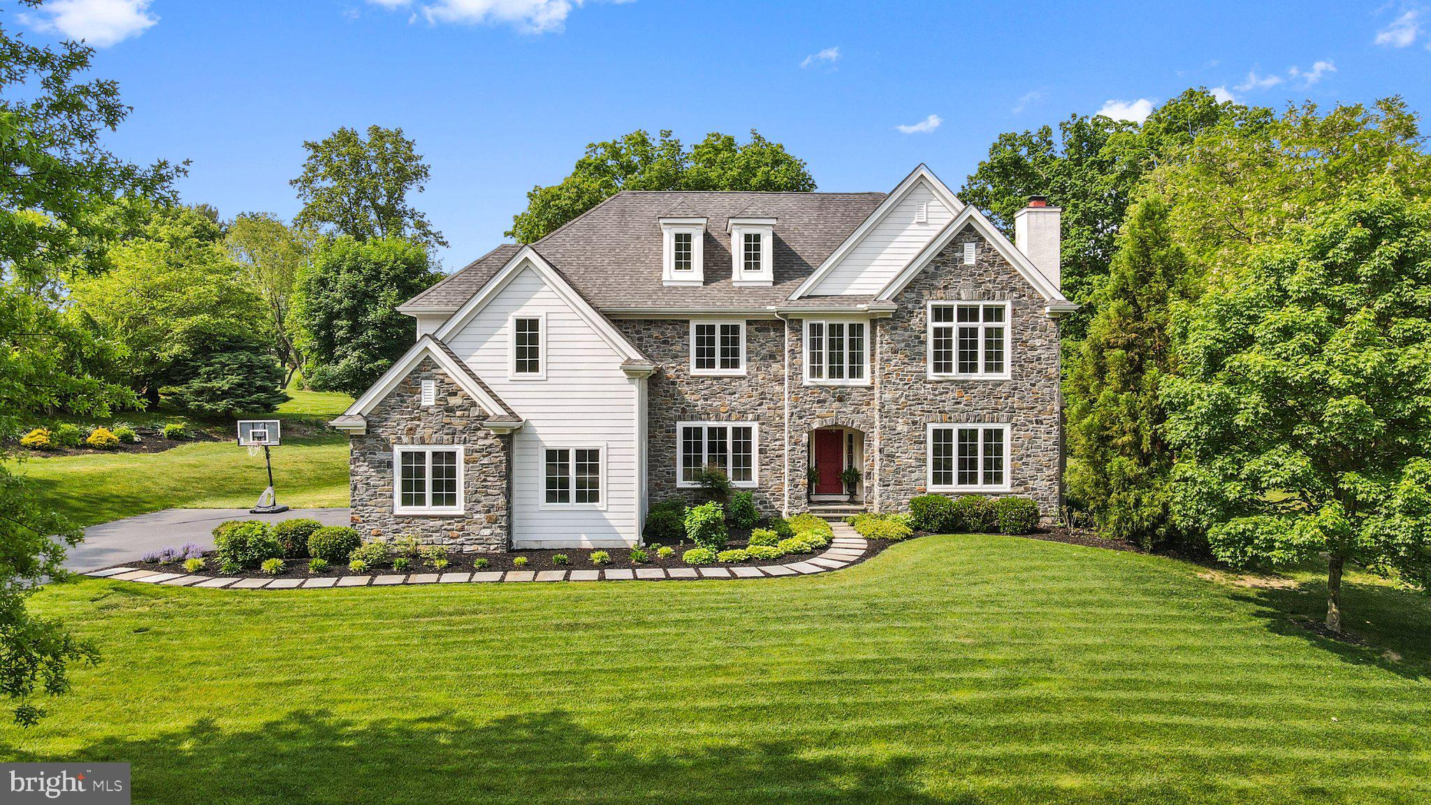 You are stepping into luxury when you walk through the door at 1200 Truks Head Lane in the sought-after community of Radley Run! This one-of-a-kind home built in 2012 sits on almost an acre of land and boasts spectacular views of open space and the Radley Run golf course. Tucked away on a private lane with just three other homes, this property offers a level of privacy and exclusivity that's hard to find.
As you approach the house, you'll be struck by its elegant exterior, featuring custom stonework, hardy board, bluestone walkways, and beautiful landscaping. Inside, the home is equally impressive, with 5-inch site-finished hardwood floors, 9-foot ceilings, and an abundance of natural light. The grand foyer welcomes you in, leading to a private library on the right and an oversized dining room on the left. Custom crown molding, and wainscoting, add to the luxurious feel of the space.
The heart of the home is the custom gourmet kitchen, complete with white custom cabinets, high-grade granite countertops, and top-of-the-line appliances like a subzero refrigerator and a wolf natural gas six-burner range. A large center island with a ceramic farmhouse sink provides plenty of prep space, while the adjacent butler's pantry with a wine fridge is perfect for entertaining. The kitchen opens up to an oversized eating area with stunning views of the backyard, as well as a cozy family room with a natural gas-burning fireplace and more custom moldings.
Upstairs, the home continues to impress with 9-foot ceilings, custom moldings, and recessed lighting. The primary suite is a true oasis, featuring oversize windows, walk-in closets with custom shelving, and a luxurious bathroom with marble flooring, his and her vanities with marble countertops, and an oversize shower with frameless glass and a large soaking tub. Three additional bedrooms, each with their own unique features, offer plenty of space for family and guests. A newly renovated second-floor laundry room makes chores a breeze.
The basement is just waiting for your personal touch, with 10-foot ceilings and a walkout to the beautiful outdoor patio area. Speaking of which, the outdoor space truly sets this home apart. A flagstone patio and pavers, custom pergola, and natural gas fireplace provide the perfect setting for outdoor gatherings, while the outdoor kitchen makes grilling a breeze.
In addition to its stunning features, this home boasts an unbeatable location. Just a short distance from downtown West Chester, you'll have easy access to dining, shopping, and entertainment. Plus, with proximity to major highways like Rt 1 and 202, you'll be able to enjoy everything that Radley Run and the surrounding area has to offer. Don't miss your chance to own this truly unique property!