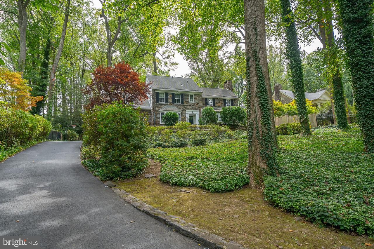 Welcome to this amazing 4 Bedroom, 4.5 Bath stone Colonial located in the highly sought after Lower Merion Township. Offering over 4,000 square feet of living space, this home is situated on a private .75-acre lot with pristine landscaping and lush greenery. Enter in the Foyer with hardwood floors and crown molding that run throughout the main level. Step into the formal Living Room featuring a marble fireplace w/ a wood mantle flanked by windows, creating a beautiful focal point. The adjoining home office/playroom/bonus area has skylights providing an abundance of natural light. Across the foyer, the formal Dining Room with stylish light fixtures and bay window offers a beautiful space to host dinners. Continue to the Kitchen which boasts white cabinetry, tile backsplash, stainless steel appliances, and a bank of windows for plenty of natural light. An adjoining breakfast room overlooks the backyard and is a perfect place to enjoy your morning coffee or a casual meal with family and friends. Custom built-ins add a touch of charm and provide additional storage space. Direct access to the garage makes it easy to bring in groceries and other items. Additionally, the kitchen has access to a private slate patio, providing a peaceful outdoor space to relax and enjoy the fresh air. A convenient Half Bath just off the kitchen makes it easy to accommodate guests. Make your way up the stairs to the landing where a picturesque window w/ built in window seat overlooks the back yard. The spacious Primary Bedroom en suite is equally impressive with double closets and an updated Full Bath with tile surround. Three additional Bedrooms and 2 Full Baths complete the second level. This property also features a finished basement with plenty of space for a home theater, game room, or gym, and ample storage space plus the 4th Full Bath. Outside, you'll love the expansive, private backyard with a spacious patio, perfect for outdoor entertaining and relaxation. Located in the award winning Lower Merion School District within the "Choice Zone" for Lower Merion or Harriton HS and walkable to Lower Merion HS. This home is just minutes away from Narberth & Ardmore Train Stations, shopping & dining, making it the perfect blend of luxury and convenience. Don't miss out on this incredible opportunity to own a piece of paradise in one of the most sought after neighborhoods in Montgomery County.