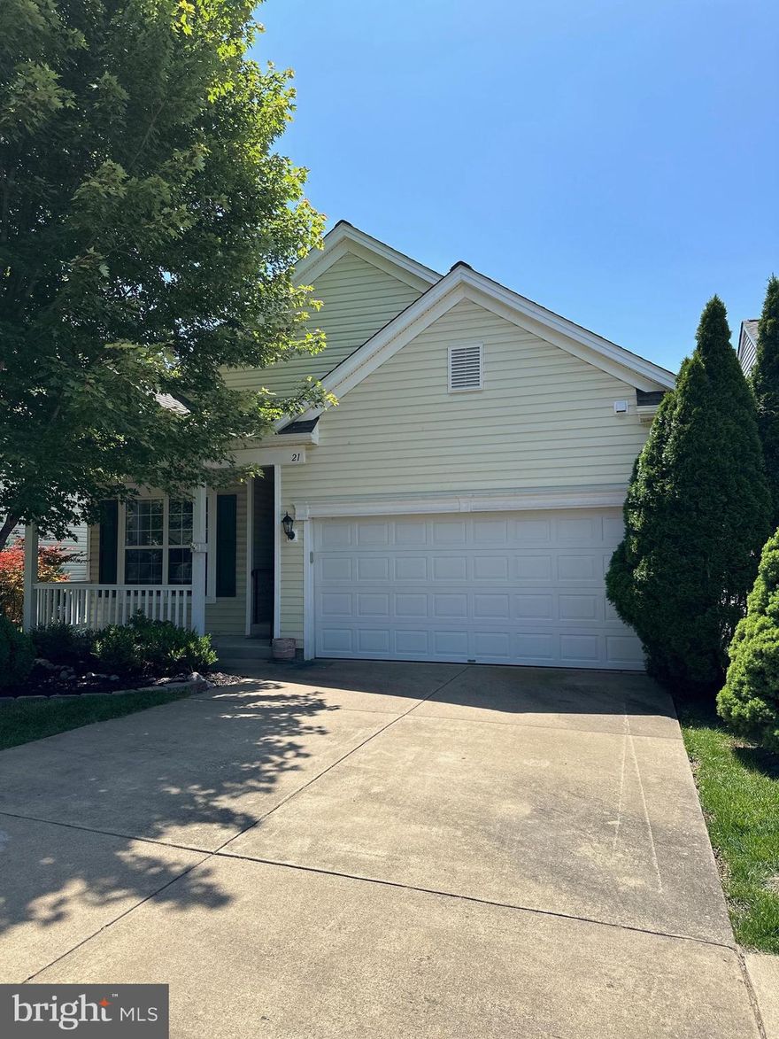 Welcome to 21 Buchanan Ct, a beautiful 2,400 sq. ft. two-level Colonial in the highly sought-after 55+ Falls Run community! With a new HVAC system, roof and siding, timeless architectural details, and a vibrant neighborhood full of amenities, this home offers the perfect blend of comfort and lifestyle.

Step inside to find wainscoting details and gleaming hardwood floors in the main living areas, complemented by fresh new carpeting in the bedrooms and basement. The bright and functional kitchen features classic oak cabinets, stainless steel appliances, a pantry for extra storage, and plenty of room for meal prep. A lovely sunroom with a tiled floor, charming windows, and a ceiling fan offers a bright and cheerful space to relax year-round. Step outside onto the covered patio to enjoy the fresh air and serene outdoor space.

The primary bedroom is a cozy retreat with plush carpeting and a spacious walk-in closet. The en suite bathroom features a dual vanity, tiled floors, and a walk-in shower. A second bedroom, also carpeted, and a full bathroom with a tub round out the main level living space.

Downstairs, the carpeted basement provides a large recreation room complete with a gas fireplace, perfect for cozy evenings. Additionally, there's a den, a third bedroom, and a full bathroom with tile flooring and a walk-in shower—ideal for guests or extended living space.

Additional highlights include a two-car garage and a new HVAC system for worry-free comfort.

Falls Run is a gated, dynamic, active community with an abundance of amenities, including a pool, community center, bocce courts, tennis courts, and numerous planned activities to keep you engaged and connected.
Don't miss your chance to live in this delightful home within one of the area's most vibrant communities!
Some photos in this listing have been virtually staged to help visualize the home's potential.
