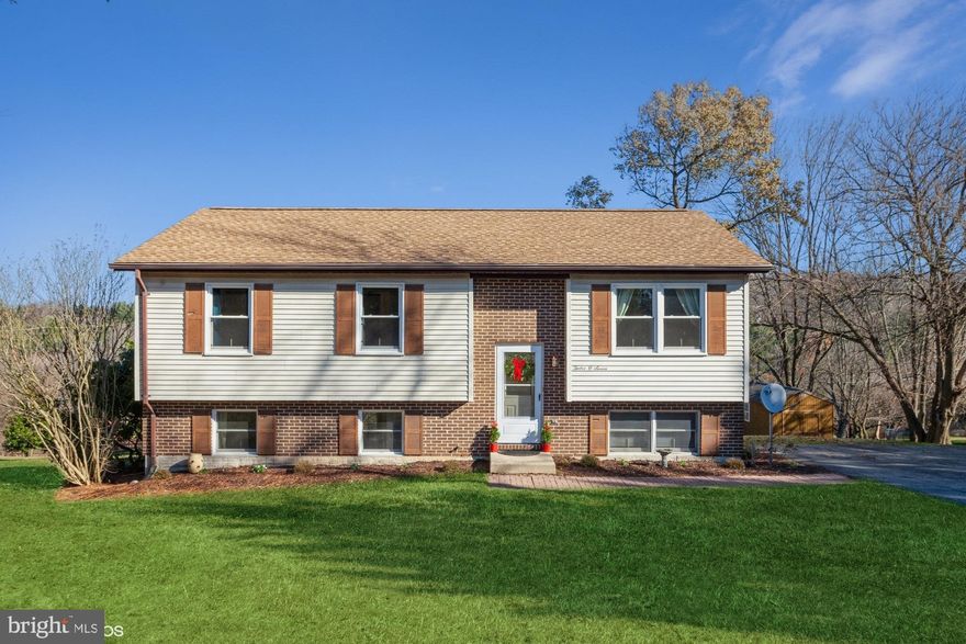 Beautiful move-in ready four bedroom, two bath home on an acre lot.  Gorgeous lot with a deck and two sheds.  Brand new remodeled kitchen with stainless steel appliances, granite countertops, island with seating, and room for a dining room table.  The kitchen/dining room is open to the living room.  Three bedrooms and a full bath with new vanity and toilet complete this level.  Downstairs you'll find a finished lower-level family room with a wood stove, a second full bath, a fourth bedroom, a laundry room,  and a bonus space off of the family room that can be used as an office or play area.  New carpet throughout and the house has been freshly painted. 
 Welcome to your new home!