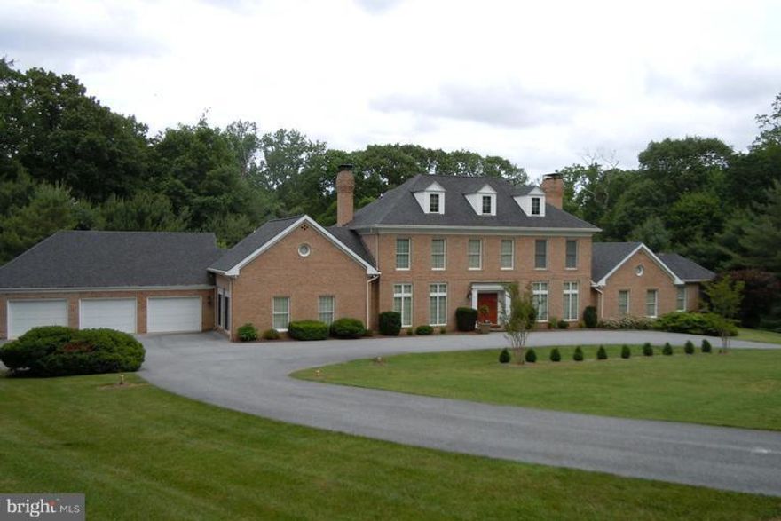 Exquisite Georgian style home features top of the line appliances and granite countertops,  Au pair/guest suite.  Separate cabana kitchen and his and her baths serve pool area. Paneled library, family room, great room and living room. Perfect for families and entertaining. Chandelier in Sunroom excluded