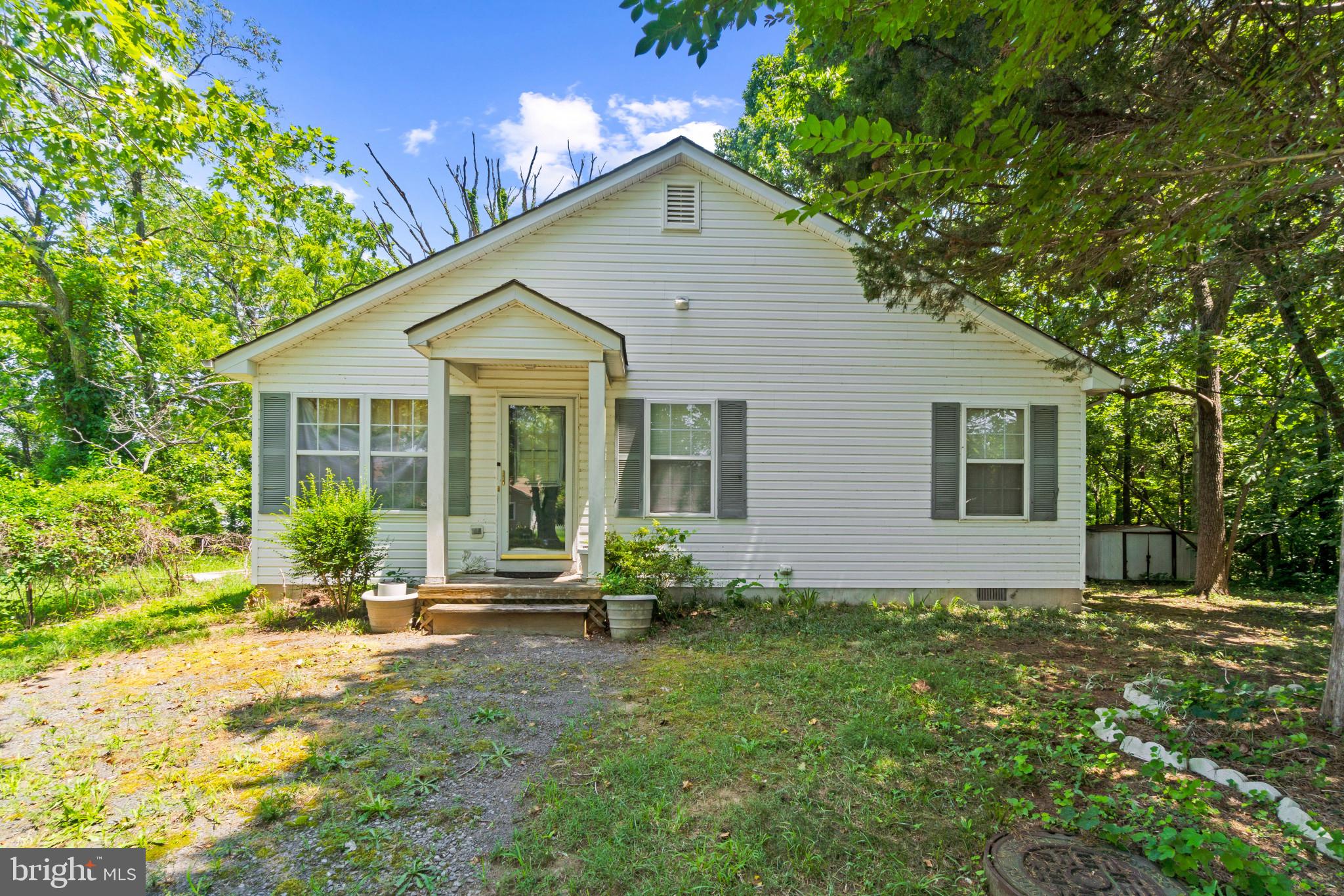 Charming single-family residence offering 1,444 square feet, 3 bedrooms, and 2 full bathrooms with water views of Neale Sound on picturesque Cobb Island. Step inside to a spacious and open main level, where vaulted ceilings and dual ceiling fans enhance the bright and airy combined living and dining room. This inviting space flows into a cozy sunroom with views of the garden and the water, along with access to the lush backyard, perfect for relaxing or entertaining. The eat-in kitchen features generous cabinet and counter space, a breakfast bar, a floral tile backsplash, and a sunny breakfast nook. Just off this space is the private primary suite, complete with a walk-in closet and an attached full bath with an oversized vanity. Down the hallway near the front entry are two additional well-sized bedrooms, a centrally located second full bathroom, and a pantry/storage closet. Located just blocks from water access, this home is ideal for boating, paddleboarding, kayaking, and other water sports. Cobb Island residents also enjoy access to a charming community park with a playground, the waterfront Scuttlebutt Restaurant & Marina, a local market, and a post office—everything you need for laid-back coastal living.