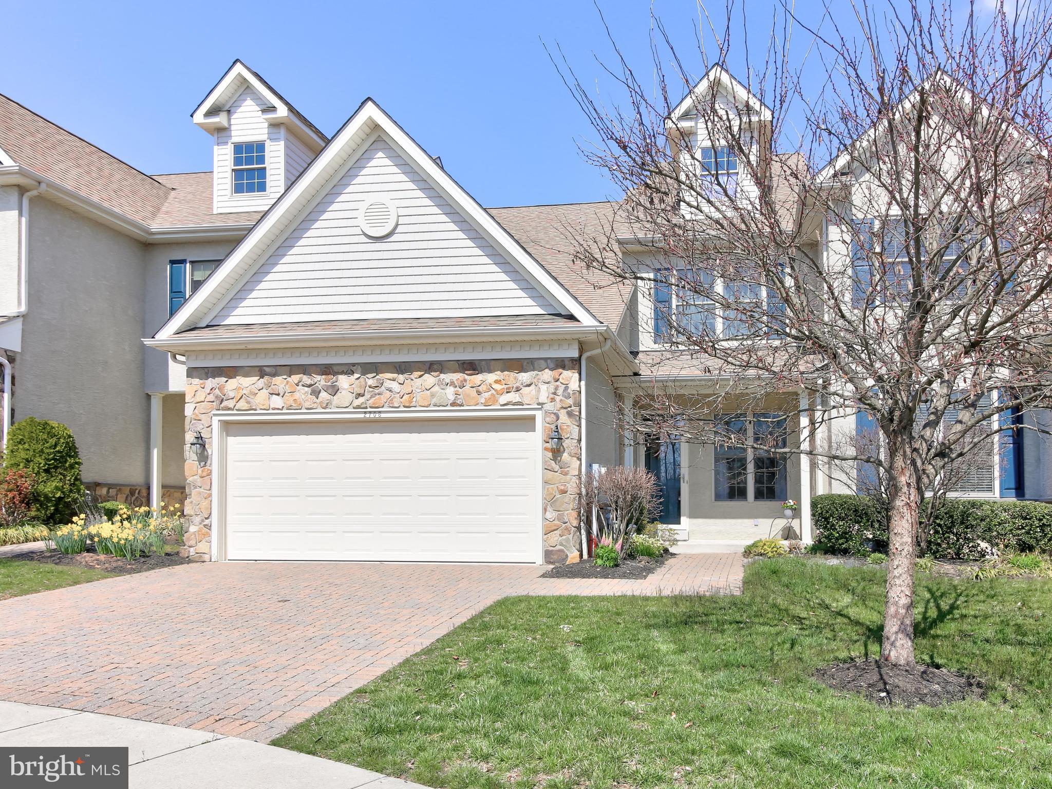 This spacious townhome has a perfect layout. Upon entry is a warm living room with wainscoting and hardwood floors that lead you throughout the home. Down the hallway past the elegant staircase is the kitchen and dining room space. The kitchen has a granite island with room for seating. There is plenty of cabinetry in the kitchen, a pantry closet, and matching black appliances. The French door and matching floor-to-ceiling window allow for some fantastic natural light into the dining room and kitchen. The French door opens onto the composite deck where you can entertain and grill. The first-floor laundry room with a utility sink has a door to the two-car garage. The powder room is tucked past the staircase along the hall. Quietly positioned at the back of the house is the master oasis. The bedroom has a sweeping vaulted ceiling and well-placed privacy windows and two fabulous closets. The attached master bath has double sinks with a vanity space between to sit. A full-size shower, and separate soaking tub to relax. Back up the front staircase is the loft/den/flex space. You can decide how you d like to utilize the area. It has a huge closet for storage. There is a spacious hall bath with a double vanity and full walk-in shower. There are two spacious bedrooms on this floor, and each bedroom has a huge walk-in closet. The basement is unfinished and has a hook up for a bathroom and a safety exit window if you want to finish the space or have a legal bedroom built out. There is a sump pump and the hot water heater is from 2018. An age restriction for the community limits occupancy to be 19 or over and one owner needs to be over 55 years of age. Because of the current ratio of the community, the new owner can be 45 years of age.