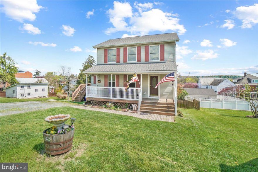 Beautifully updated home in Woodsboro on a quiet street. The living room leads to a separate dining room and they both have elegant wide plank hardwood floors. The updated kitchen has luxury vinyl plank flooring, stainless steel GE Profile appliances, custom back splash and a beautiful live edge wooden bar counter. The main level primary suite is enormous with a large sitting/office area and private bathroom en-suite. A mud room, guest powder room and no maintenance deck complete this level. Upstairs you will find three bedrooms and two additional bathrooms, all freshly painted. The walk-out basement offers a huge rec room with flagstone tile and a gorgeous built in wet bar with stone wall detail and plenty of space for entertaining. There is also a guest powder room in the basement, a second sitting area and a great space for a reading nook or office with lots of light. The heading is supplemented with a wood burning furnace which is very efficient and helps to keep heating bills low.  The yard is fully fenced and includes a 12 x 12 shed, and the roof is only 5 years old. Don’t miss the opportunity to see all of the beautiful features this home has to offer.