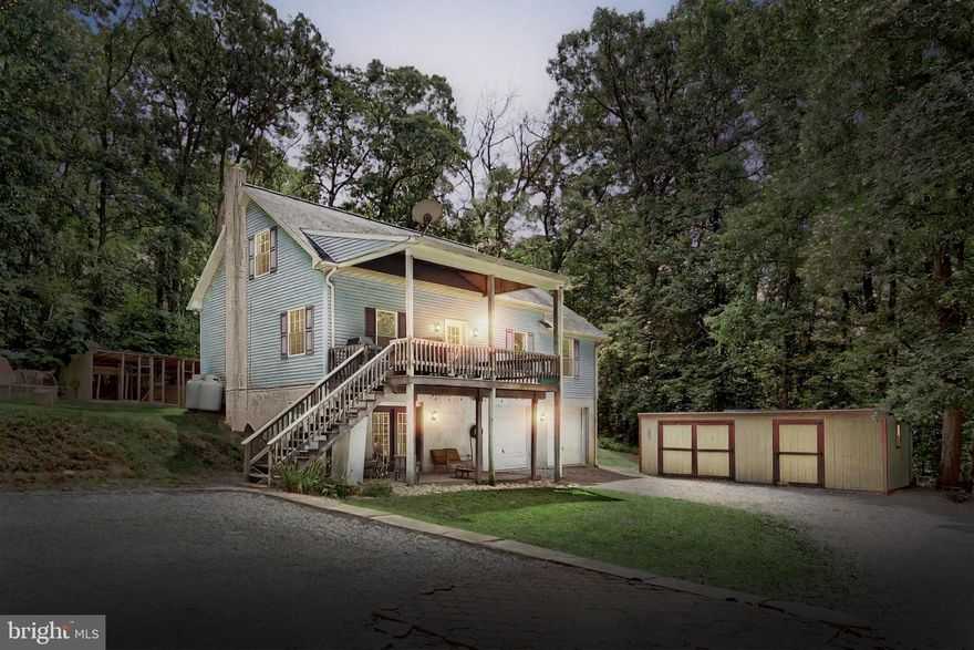 This is the ONE that you have been waiting for!!!  Located back a private lane, in a secluded setting on 1.9 wooded acres, this 3 bedroom 2.5 bath Cape Cod home is sure to please!!  Featuring a first floor primary suite with walk in closet, First floor laundry with front load washer and dryer in included, Half Bath, Large Foyer, and a Great Room with vaulted ceiling that offers an Open Kitchen, Dining, Living Area with views of the surrounding country side!!   The Kitchen includes an island, and all appliances, as well as French doors out to the back deck.  Off the foyer is the front door out to the covered front porch.  All rooms on the first floor are either LVP, Ceramic Tile, or hardwood!!!  Ascending to the second floor you will find the bedroom to the left with upgraded LVP flooring, and two closets, the bedroom to the right with LVP flooring and one closet.  The Hall bath features LVP and a Vaulted ceiling.   Descending to the basement you will be greeted by partially finished Rec Room with a wood stove, built in shelving, and a closet that is home to the propane furnace, electric hot water heater, and water softener. Off to the right side is the oversized two car garage with interior measurements of 22' deep, by 25.8' wide, with two openers, and a 200 amp electric box. Other features include two sheds, and a large chicken coop.  Surrounded by dense woods, and the great out doors, this is a hard to find seclude property. Must see to appreciate!!!  And if all of this is not enough, Comcast is available for Cable and Internet!!