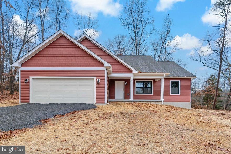 Welcome to this beautiful 3-bedroom, 2-bathroom ranch-style home, nestled on 2 acres of partially cleared land with a mix of open space and wooded surroundings in Waugh Acres. Located just off Route 522, this home offers a fantastic commuter location while still providing the tranquility of nature. Only minutes from Cacapon State Park and downtown Berkeley Springs, you'll enjoy easy access to local restaurants, shopping, and outdoor activities. This brand-new home features an open-concept living space, complete with a stainless steel appliance package in the kitchen, perfect for both everyday living and entertaining. The unfinished basement with a rough-in offers endless potential, whether you want to create additional living space, a home gym, or storage. The 2-car garage adds convenience and ample space for your vehicles or hobbies.Construction is estimated to be completed by the end of May, so don't miss out on the opportunity to make this stunning property your own! Pictures are of similar construction & not of the actual house. Schedule your private tour today!Your lender letter and deposit is all it takes to move forward.