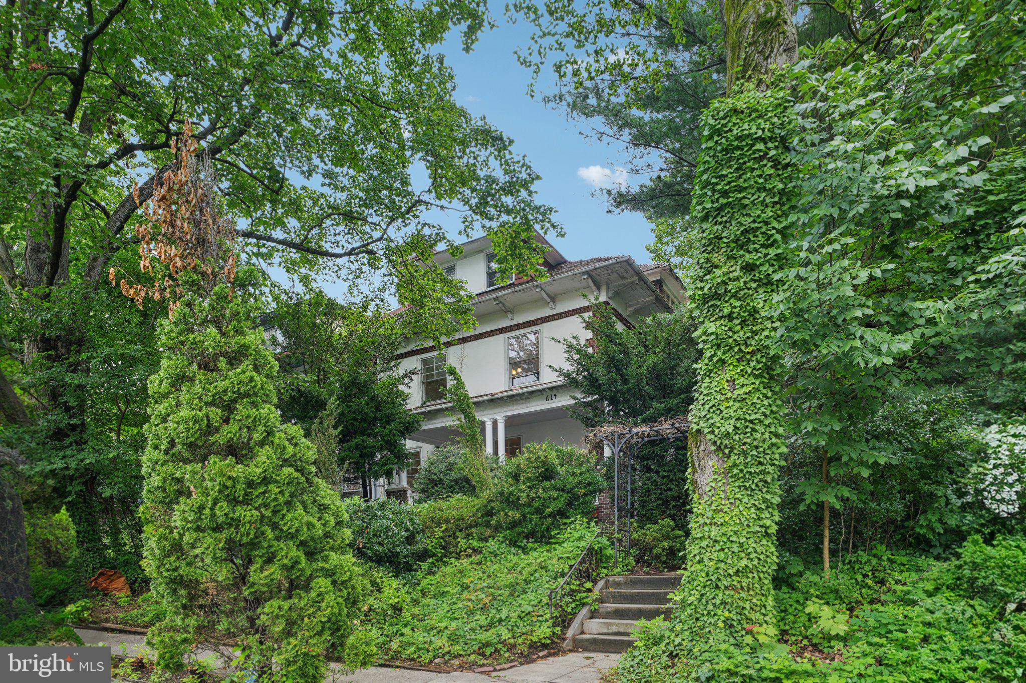 Gracious East Mt Airy twin home on a wide and lovely block lined with mature trees. While the lush foliage provides superb privacy for this home, the vibrant light and stunning character strongly shine through. Offering 5 bedrooms, 2 baths, an office, and a bright dining room. Grand spaces throughout, including the stunning living space! Substantial original character abounds. Huge rear yard; side yard; and a wonderful covered front porch—plus the home is set back from the street for additional peace and privacy. Amazing spaces and light. Kitchen and baths are not new, but are nice, have beautiful character and light, and are in move-in condition. Licensed electrician just rewired to remove all knob & tube throughout the home—modern wiring throughout. Freshly patched and painted throughout (including substantial plaster work). Beautiful original hardwood floors throughout (could be refinished for added brilliance). Brand new gas boiler. Excellent storage. Walk-out basement (large and clean).
A substantial and wonderful home with a great location. Great location—less than 5-minute walk to the Chestnut Hill East Regional Rail and a few minutes’ drive to everything Mt Airy has to offer, the Wissahickon and its 50+ miles of trails, Chestnut Hill, Manayunk & Roxborough, Center City, and all major highways. Great home, original character, lush outdoor spaces, tree-lined block, easy to park, convenient location.
