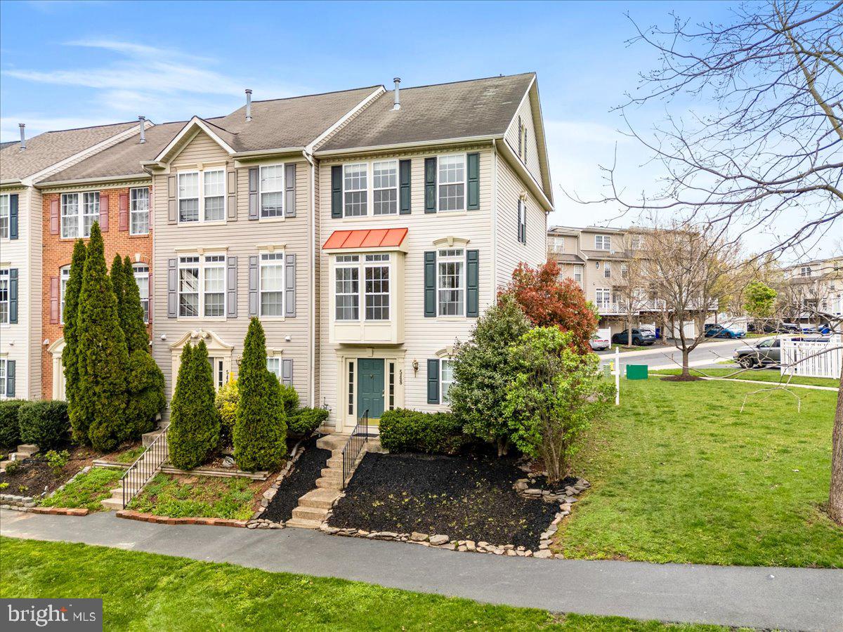 Home sweet home! This beautiful 4 level end unit has all you could want. Front of the house backs to open space, enjoying the serene spring. As you enter from the attached garage, a foyer, laundry, entryway and storage are great spaces to utilize for busy living. 2 year young carpet, fresh and lush, on all 3 top levels, updated light fixtures and crown + picture molding give your home an elevated feel. Main level brings a cozy gas fireplace, stunning custom curtains that convey, living/lounge room, dining area and sunny kitchen with gas range cooking + desk space. Living area also opens to a 8' by 17' deck, perfect for enjoying drinks with friends or early morning coffee. Third floor brings you to two bedrooms and two full baths, housing the primary suite. Top floor is the third bedroom with a closet, a private quiet retreat. Visitor parking is always readily available in the neighborhood! Dual zone HVAC makes every level comfortable in any season.
Front spring to late autumn, the neighborhood flaunts manicured grass and beautiful seasonal flowers. The neighborhood is equipped with walkways, making it a pleasure to take an evening stroll or an early morning run no matter the season.
Walk to Dutch's daughter for dinner or brunch, and this location is super close to major commuter routes (less than 5 mins to 270 and less than 15 to the MARC train).