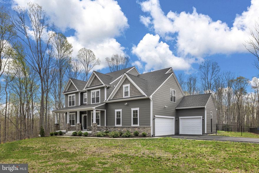 This one checks ALL the boxes! Welcome to a truly exceptional property offering the perfect blend of luxury, privacy, and versatility—all set on 40± acres with direct access to the scenic 16-mile Dahlgren Railroad Heritage Trail.

Built in 2023 by Westbrook Homes, this semi-custom residence boasts nearly 5,800 total square feet, including over 4,500 finished square feet of thoughtfully designed living space. With 6 spacious bedrooms (or the flexibility to convert one into a private home office) and 5 full bathrooms, this home easily accommodates both everyday living and entertaining.

The heart of the home is a stunning, chef-inspired kitchen featuring commercial-grade appliances, a massive island, and seamless flow into the living area complete with custom built-in shelving. Step outside to enjoy composite decking that overlooks your private backyard oasis, highlighted by a 40’ x 20’ in-ground saltwater pool and a separate fenced area for pets with convenient access from the home.

Car enthusiasts, hobbyists, or business owners will appreciate the incredible 30’ x 50’ detached shop/garage, complete with its own dedicated electric service, insulation, heating and cooling, a 12’ x 20’ interior office, soaring 14’ ceilings, three 10’ x 10’ garage doors, and two walk-in entrances. In addition, the home offers a 2-car attached garage plus a separate 1-car/toy garage for added flexibility.

Practical upgrades include a paved driveway and a 22kW standby propane generator with transfer switch for peace of mind.

Enjoy the tranquility of country living without sacrificing convenience—located just 15 minutes to Dahlgren Naval Base and 25 minutes to Downtown Fredericksburg.

This is a rare opportunity to own a turn-key property that offers space, function, and high-end finishes in an unbeatable setting.