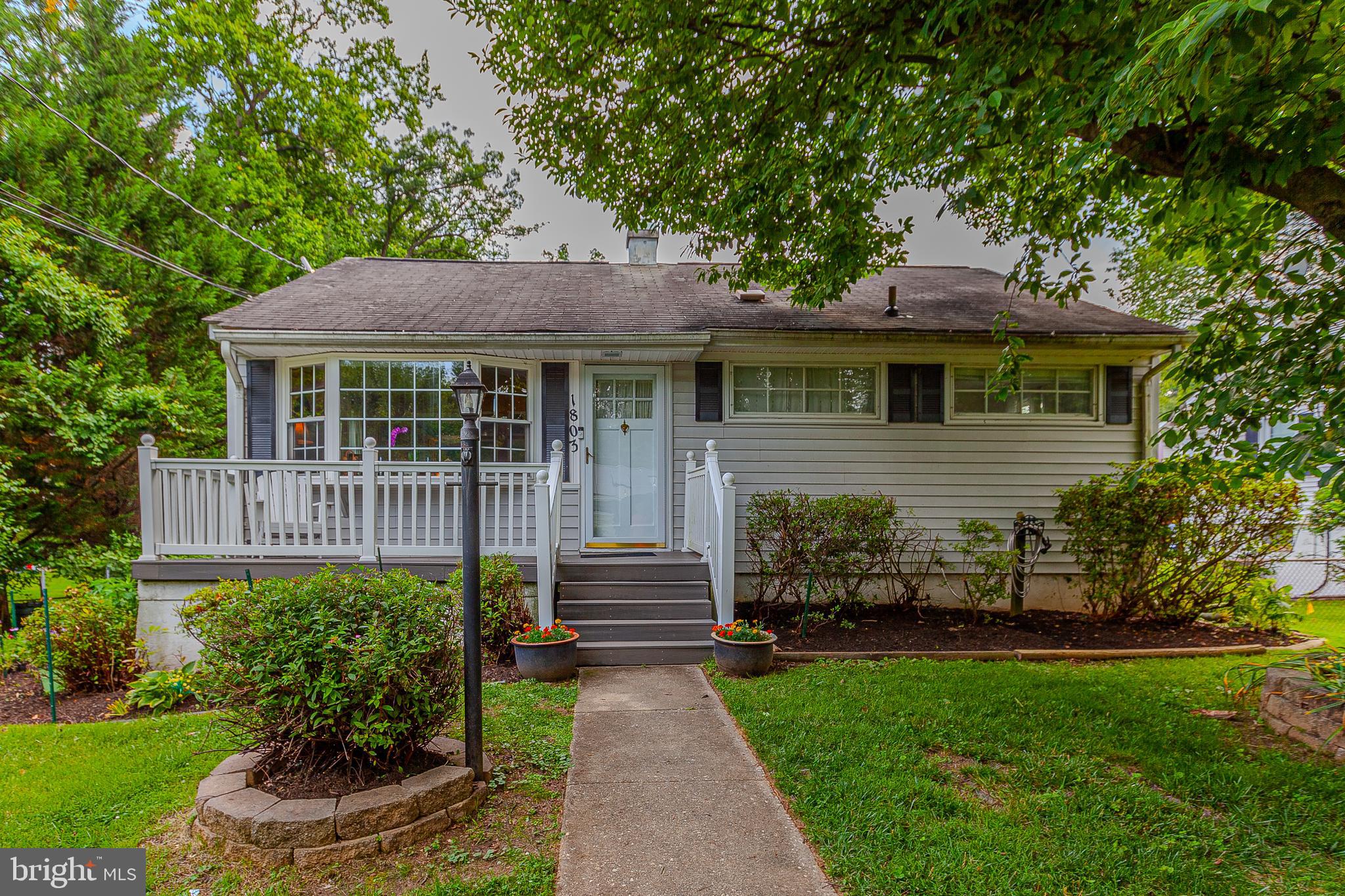 Truly an exceptional value in the heart of Rockville! This beautiful Rockcrest rambler sits on a private lot and includes many attractive features and thoughtful updates throughout! A spacious main level holds a relaxing living room, three sizable bedrooms, a recently updated full bathroom, and an open concept, and a gourmet kitchen that opens to a large dining area addition with access to a private deck! A fully finished, walk-out lower level holds a cozy family room with elegant built in bookshelves, a recently remodeled full bathroom, an at home office/guest room, an additional bedroom, a laundry room, and a convenient workshop! Enjoy quiet summer evenings on a large deck that overlooks a well-landscaped, fully fenced backyard that holds a variety of vegetable and flower gardens! Also enjoy a covered patio, greenhouse, and plenty of room for fun and recreation in grassy space! Recent updates and special features include refinished hardwood flooring, updated refrigerator, updated range, updated CoreTec Iona Stone vinyl flooring in kitchen, updated decking on rear deck, an elegant, reliable cast iron Jøtul Lillehammer gas stove , and a pull-down attic for storage! This impeccable Rockville location provides close proximity to Twinbrook Metro, Rockville Pike shopping/restaurants, area schools, and Rock Creek Park trails! Come quickly! This one won't last!