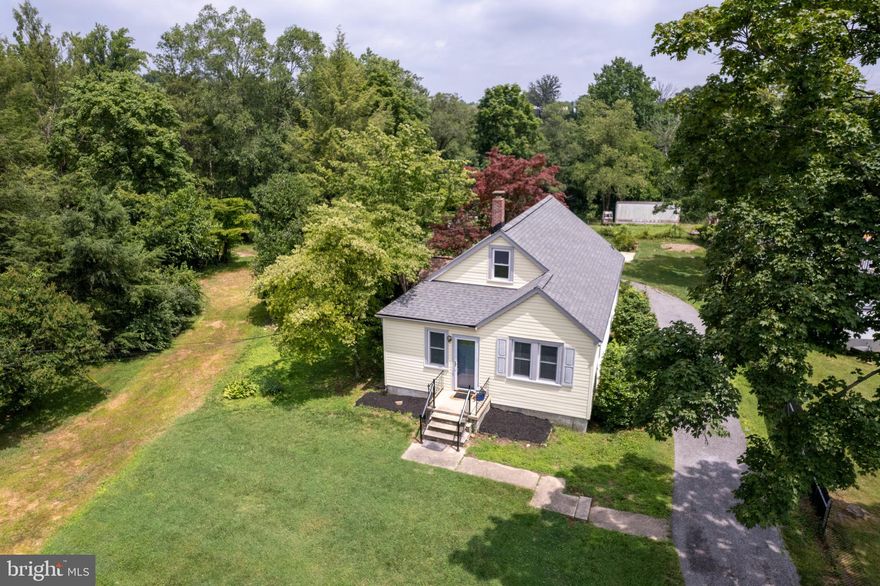 Major Price Reduction, Priced for immediate sale, previous sale fell through . House appraised for $340,000. 4 Bedroom 2 Bath Cottage on .34 Acre Level Lot. New Kitchen with Farm Sink, Quartz Countertop w/ Back-splash, New Appliances and Custom Wood Cabinets, New Roof, New Paint, Luxury Vinyl Flooring, Water Heater all in 2022, Recent HVAC Heat Pump, Remodeled Bathrooms. Double Pane Windows, Vinyl Siding. Super Bath in Lower Level Has Whirlpool Tub & Separate Shower.  New Carpet  installed on 2nd Floor 9/1/23. Recent Painting on all Levels. Level Lot.  Vacant lots to left of the property 1.5 acres are available and sold separately .